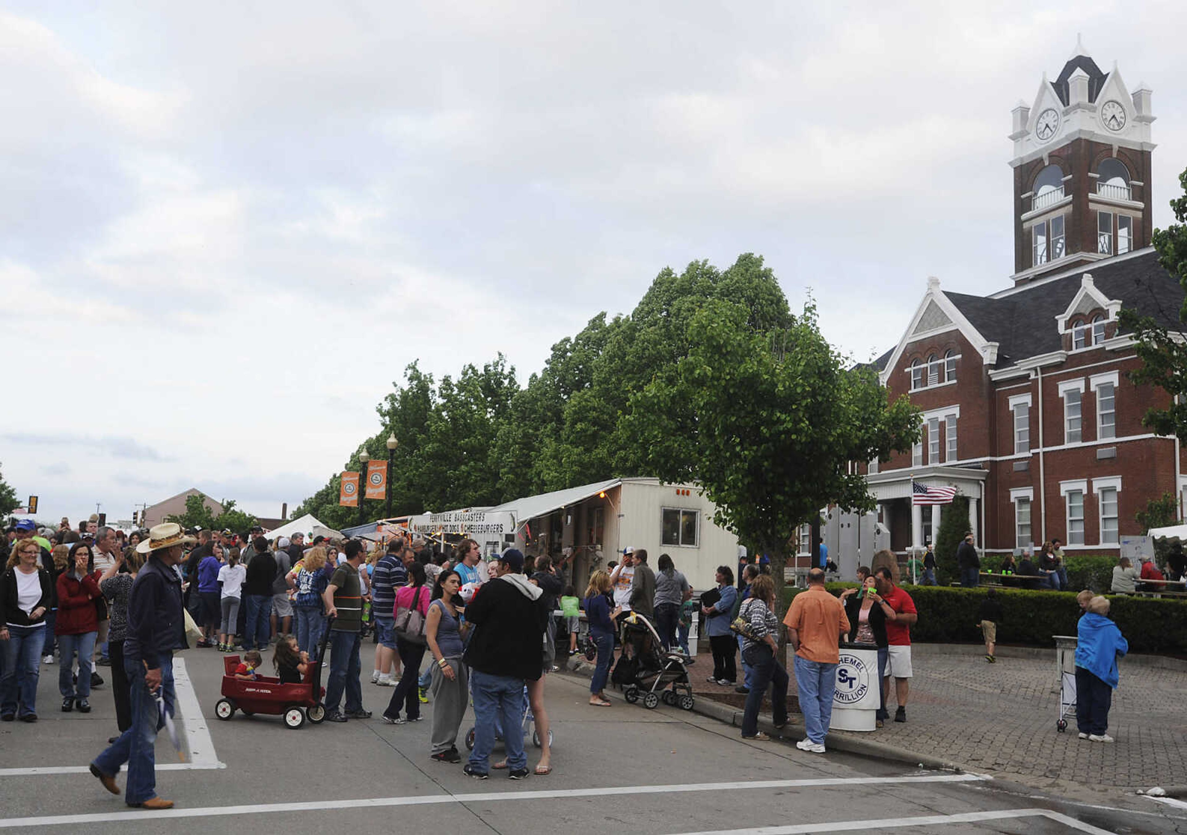 Attendees browse the food options during Perryville Mayfest Friday, May 10, in Perryville, Mo. This year's Mayfest theme is Peace, Love, Perryville Mayfest.