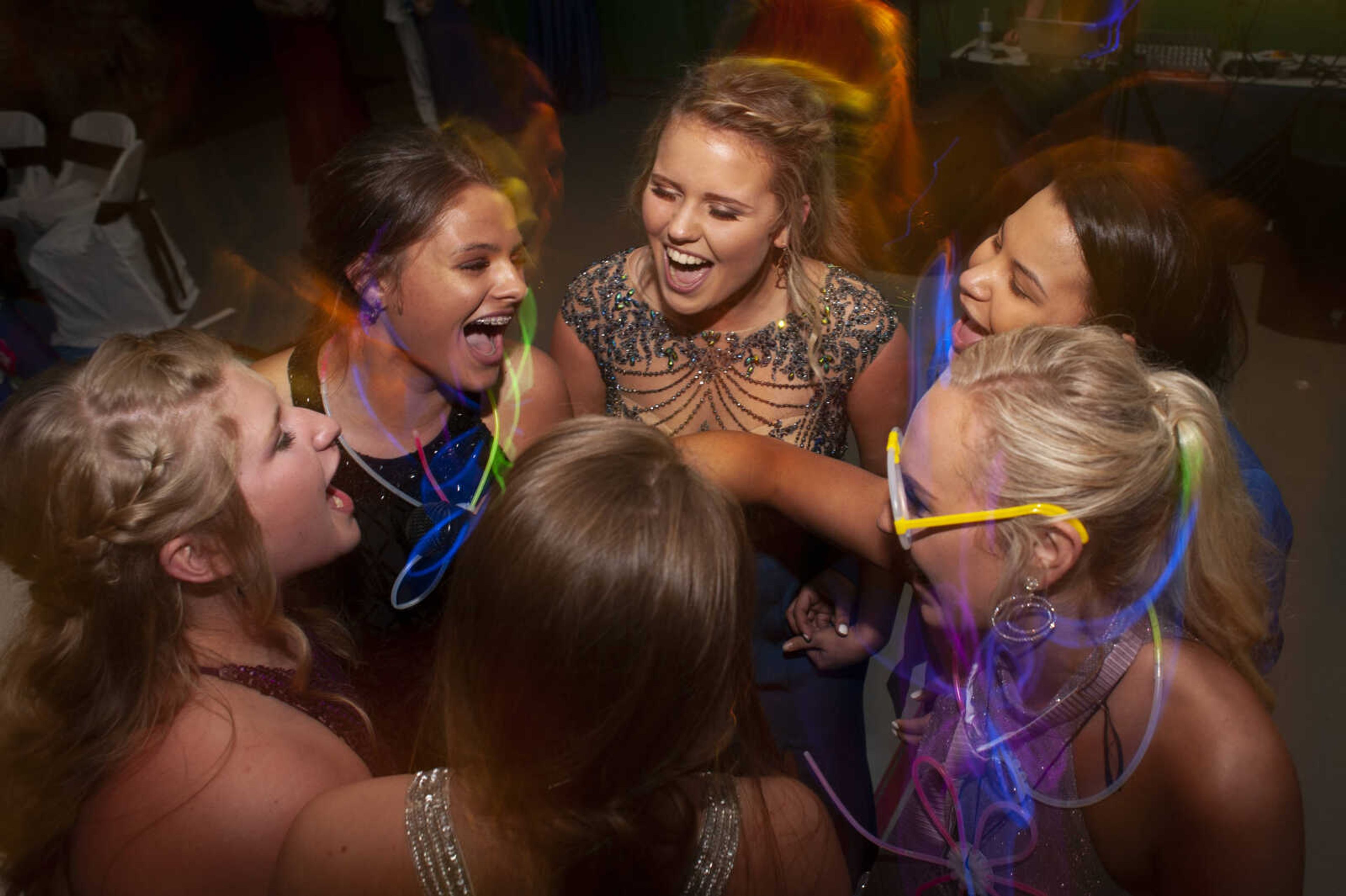 Prom guests belt out Shania Twain's "Any Man of Mine" during Delta High School's prom on Saturday, April 13, 2019, at the Delta Community Center.