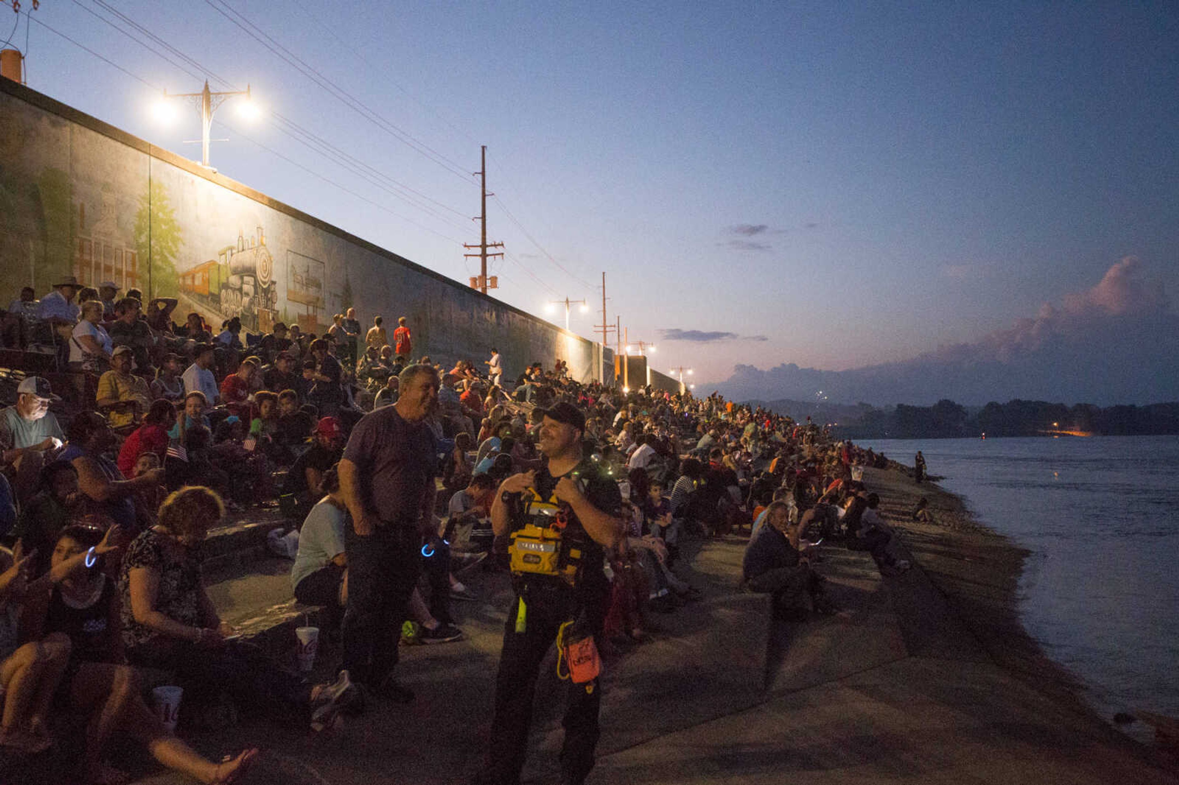 GLENN LANDBERG ~ glandberg@semissourian.com

A crowd takes in the firework display on the riverfront for the Great American Fourth of July celebration in Downtown Cape Girardeau Monday, July 4, 2016.