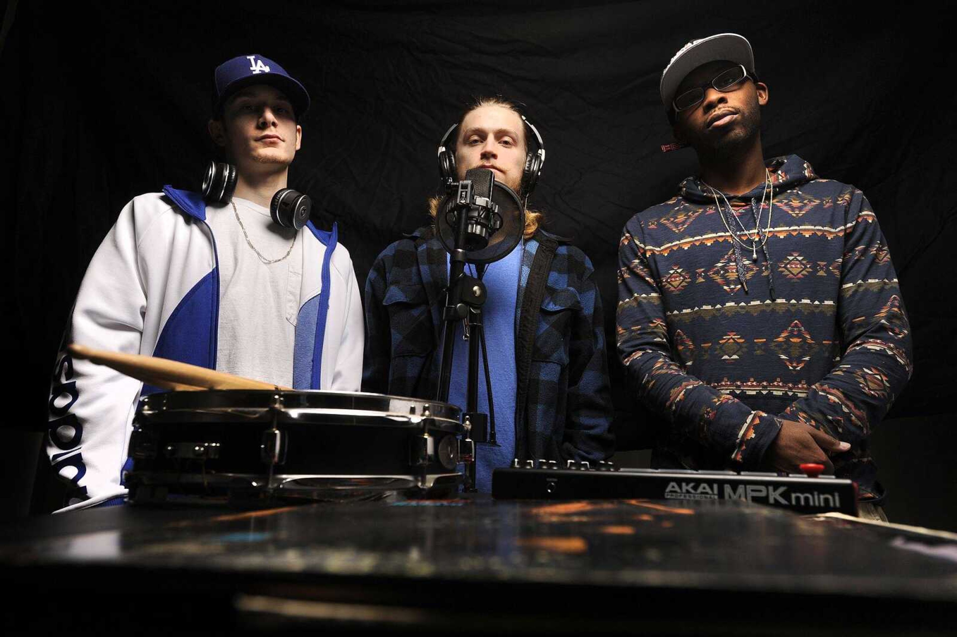 Nik "Niko Scarpy" Scarpaci, left, Angelo "Gelo" Wilson, center, and Amir "Amiricle" Waters of hip-hop group Imaginary Friends pose for a photo Wednesday.