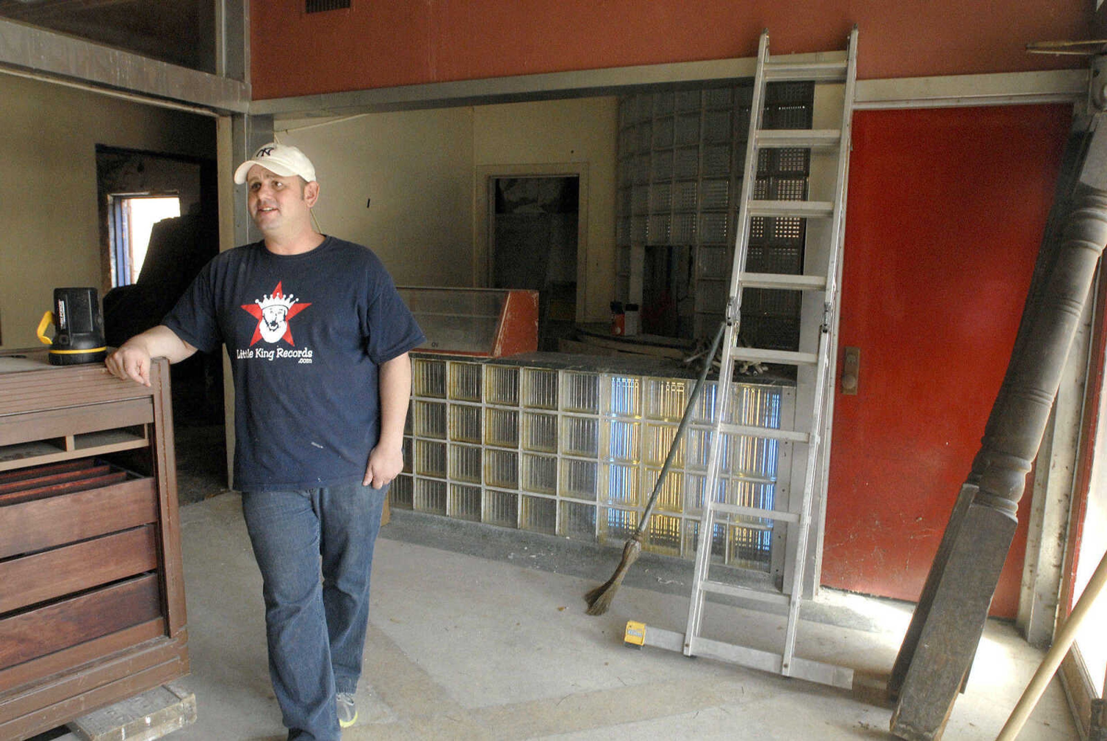 LAURA SIMON ~ lsimon@semissourian.com
The Esquire Theater's new owner John Buckner  opens the theaters door to the public Monday, October 17, 2011 as he liquidates some of the interior furnishings. Buckner is selling some of the furnishings and recycling others as "some things are worth money and some things are not." The Esquire has also been housing the set from the movie "The Green Mile", which Buckner has donated to the Scott City and Cape Girardeau Parks and Recreation Department as well as the River Campus of Southeast Missouri State University. The "cleaning out" phase of the Esquire renovations will be ongoing for the next two weeks and Penzel Construction will move forward the first week of November with securing the marquee and setting up scaffolding. A Cape Girardeau film maker will be documenting the renovation process.