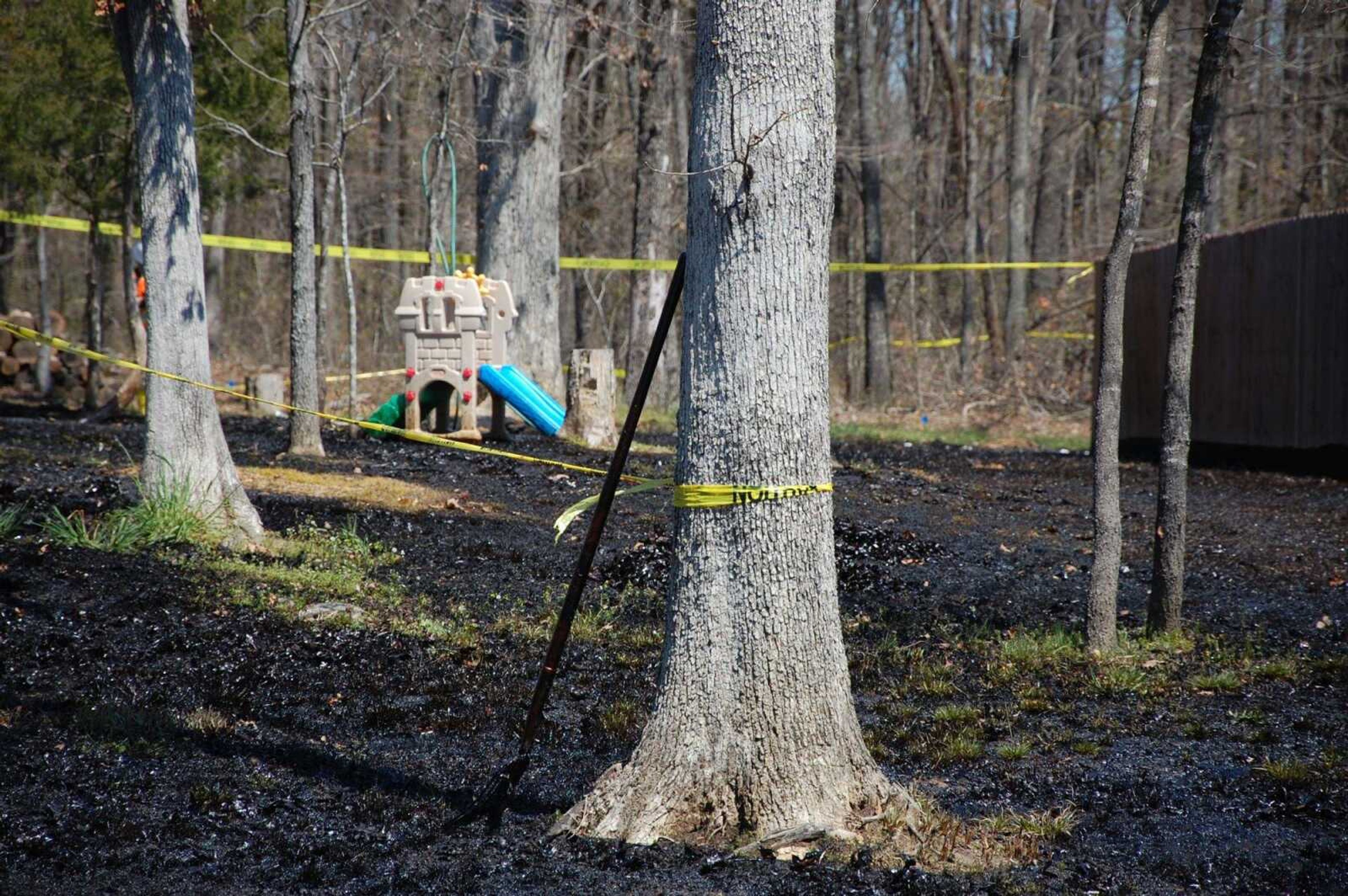 Oil covers the ground around a slide April 1, 2013, in Mayflower, Arkansas, days after a pipeline ruptured and spewed oil over lawns and roadways. The Obama administration on Friday finalized new regulations for almost 200,000 miles of pipelines that transport crude oil, gasoline and other hazardous liquids.