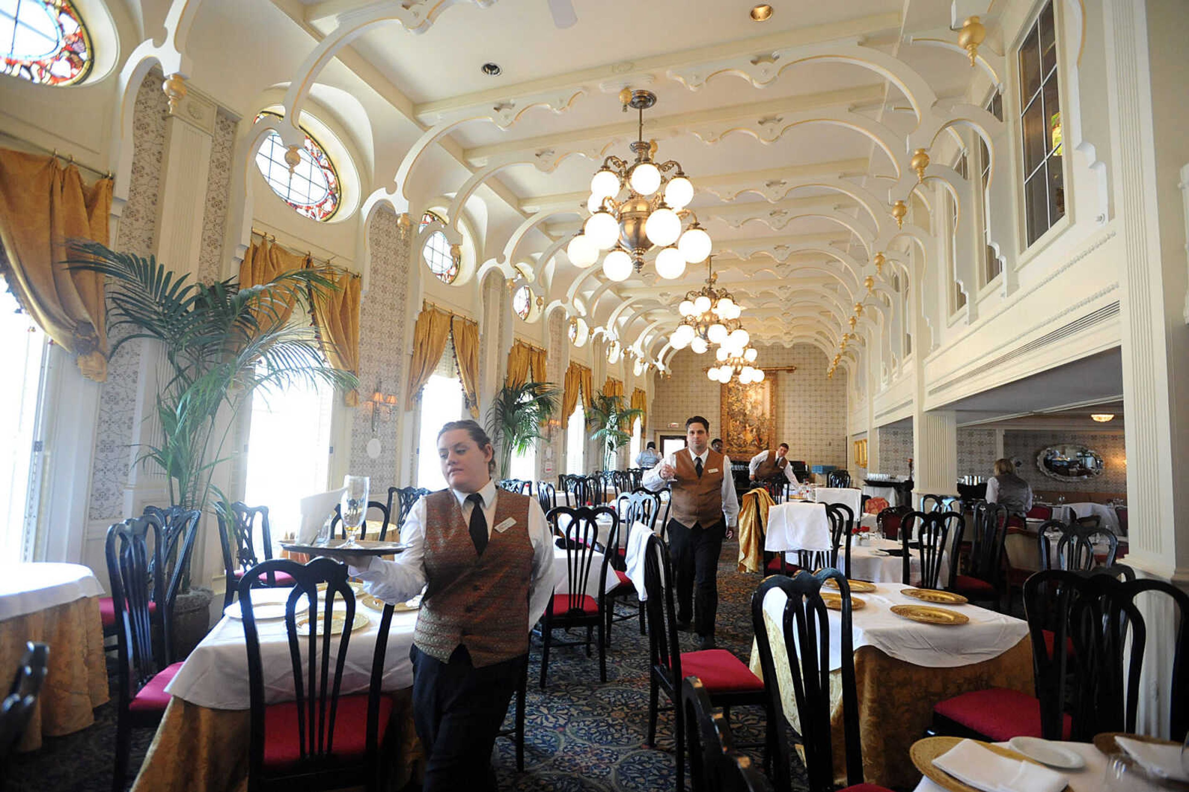 LAURA SIMON ~ lsimon@semissourian.com
Servers make their way through the J.M. White dining room on board the American Queen steamboat Monday, July 2, 2012 as it is docked in downtown Cape Girardeau.