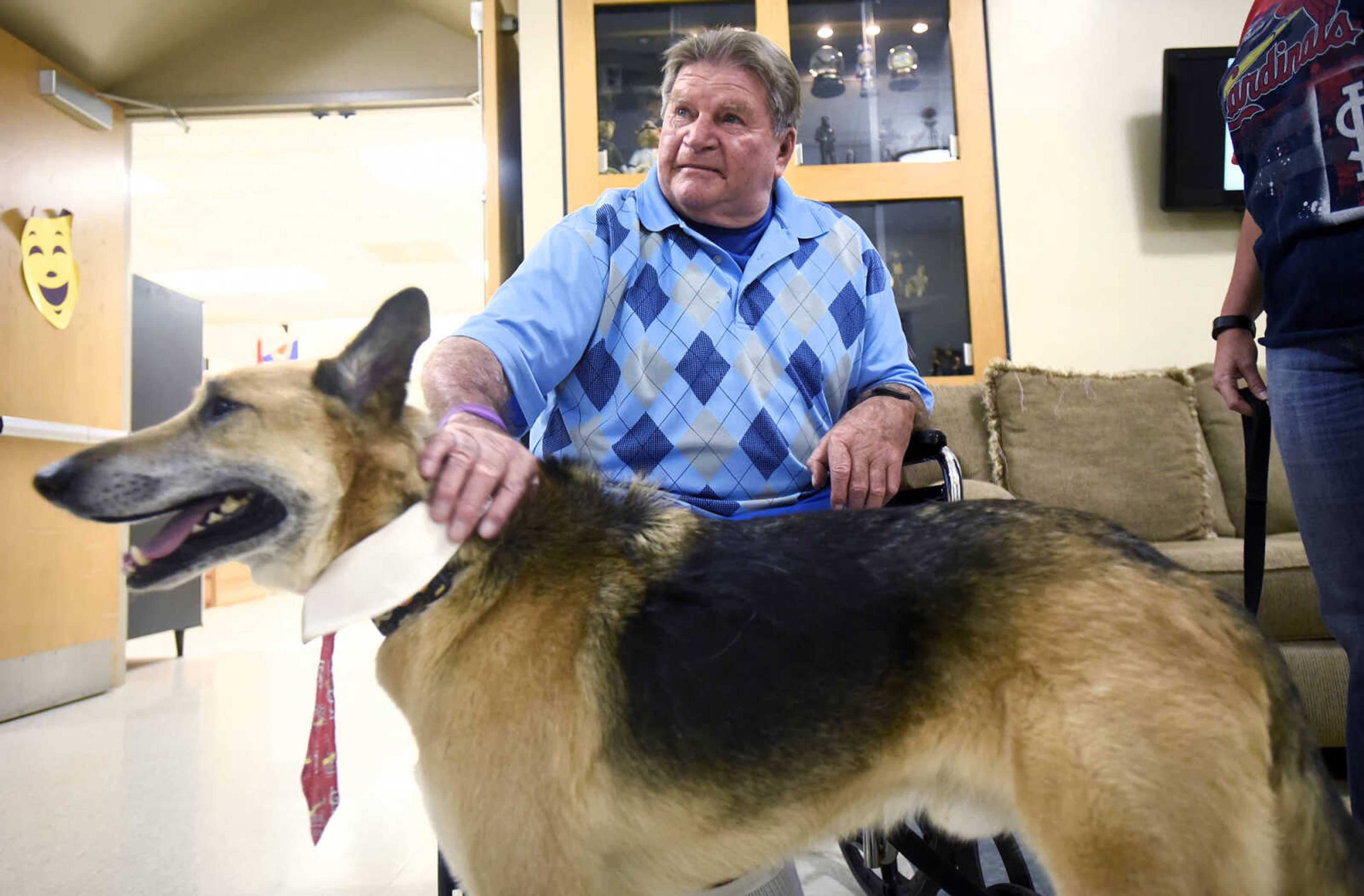 Cotton Bernard visits with Max on Tuesday, Feb. 21, 2017, during the Pet Pals stop at the Missouri Veteran's Home in Cape Girardeau.