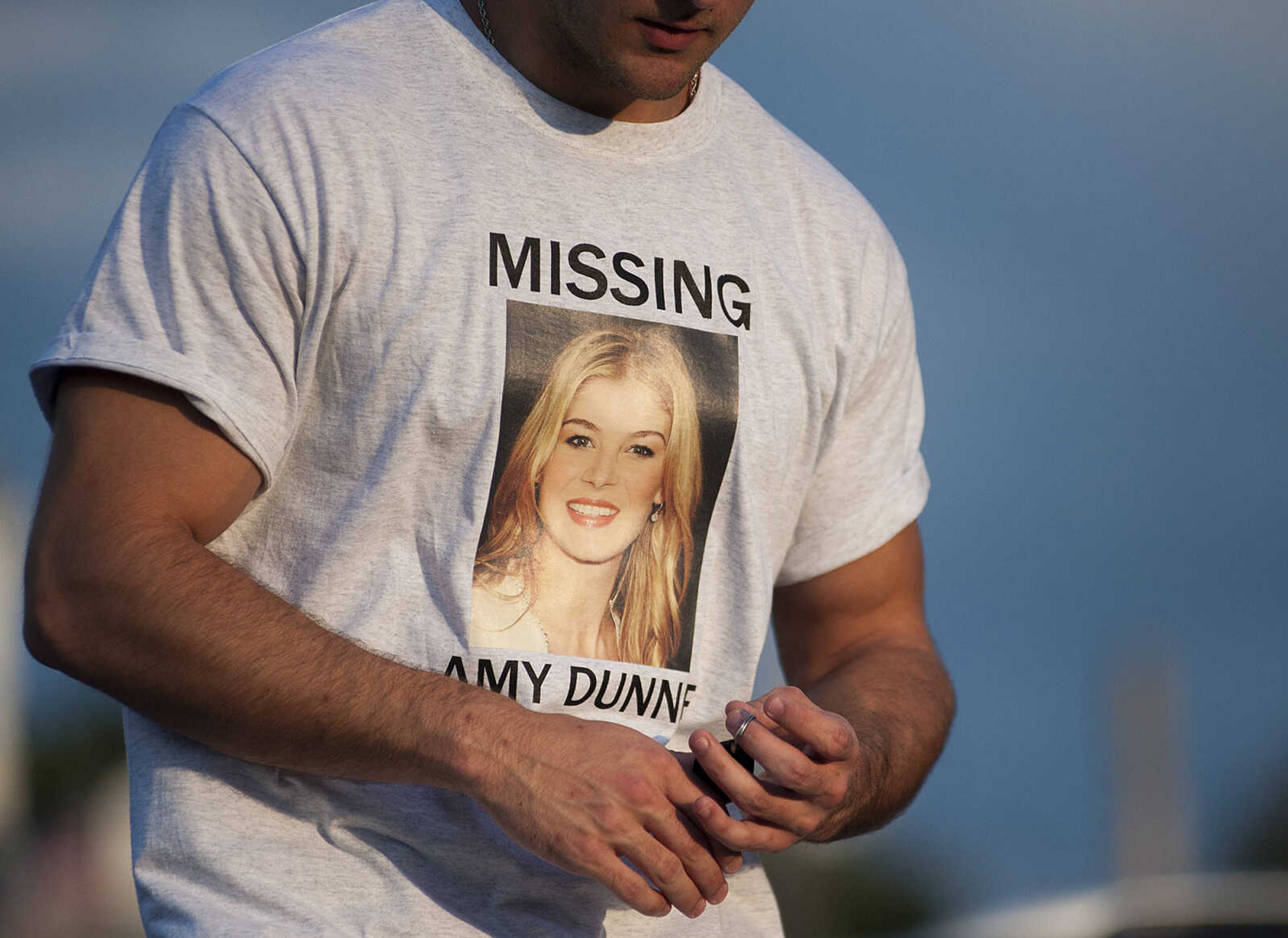 ADAM VOGLER ~ avogler@semissourian.com
Connor Norman, of Cape Girardeau, an extra working on the 20th Century Fox feature film "Gone Girl," wears a "Missing, Amy Dunne," t-shirt before filming a sceneThursday, Oct. 3, in downtown Cape Girardeau.