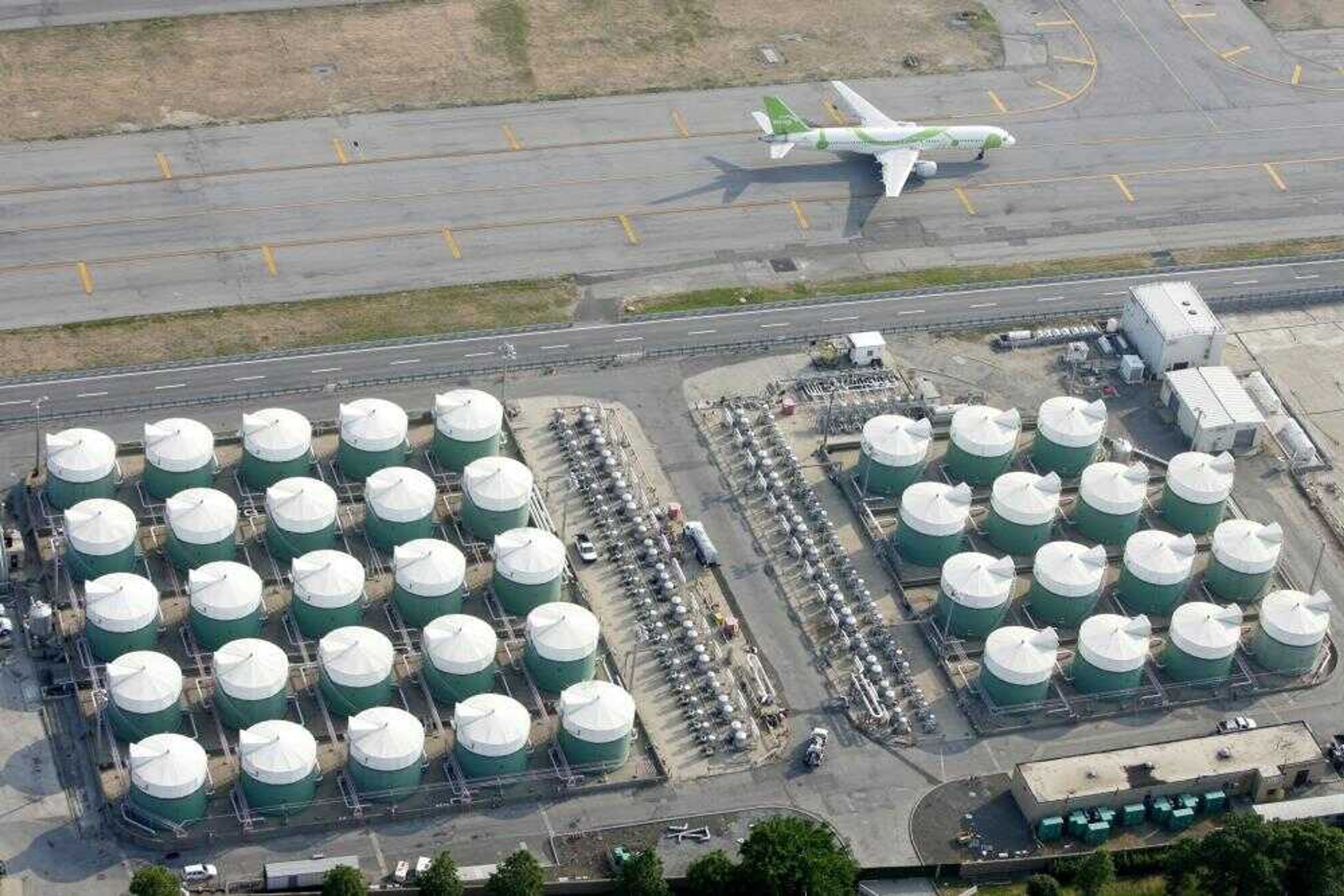 A field of storage tanks was seen Saturday on the grounds of John F. Kennedy International Airport in New York. A suspected terrorist cell planned to destroy John F. Kennedy International Airport, kill thousands of people and trigger an economic catastrophe by blowing up a jet fuel artery that runs through residential neighborhoods, authorities said Saturday. (Seth Wenig ~ Associated Press)