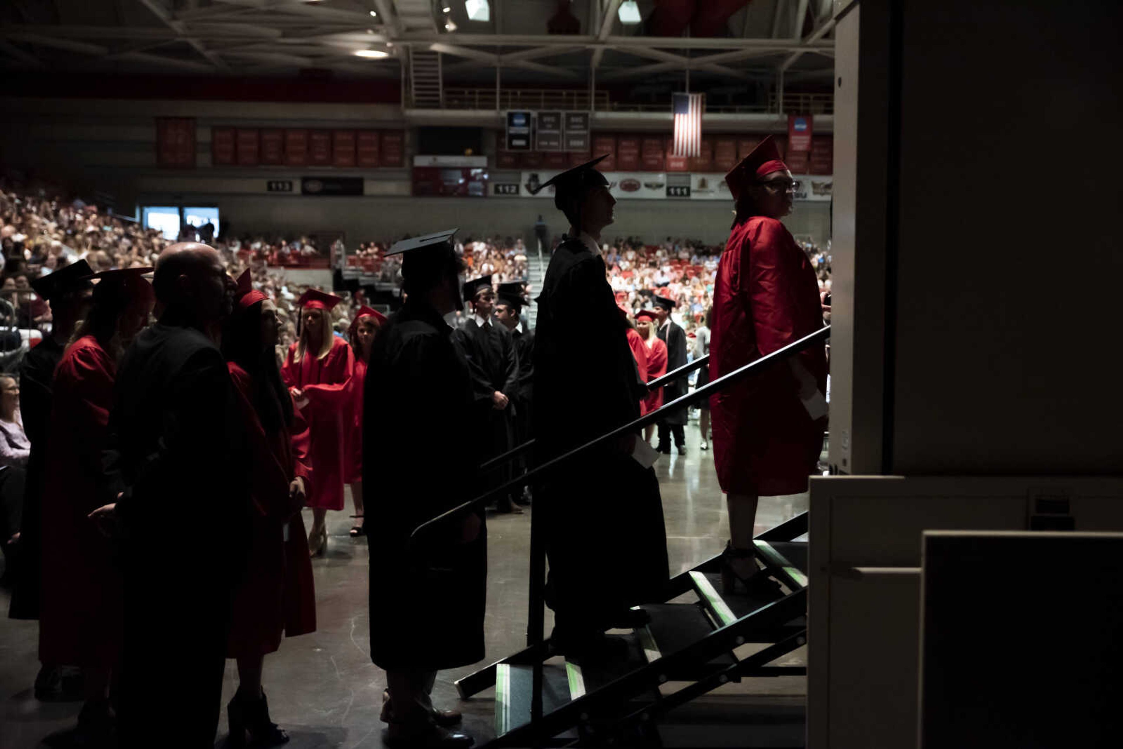 Graduates wait to walk across the stage and get their diplomas during the Jackson High School Class of 2019 Commencement at the Show Me Center Friday, May 24, 2019, in Cape Girardeau.