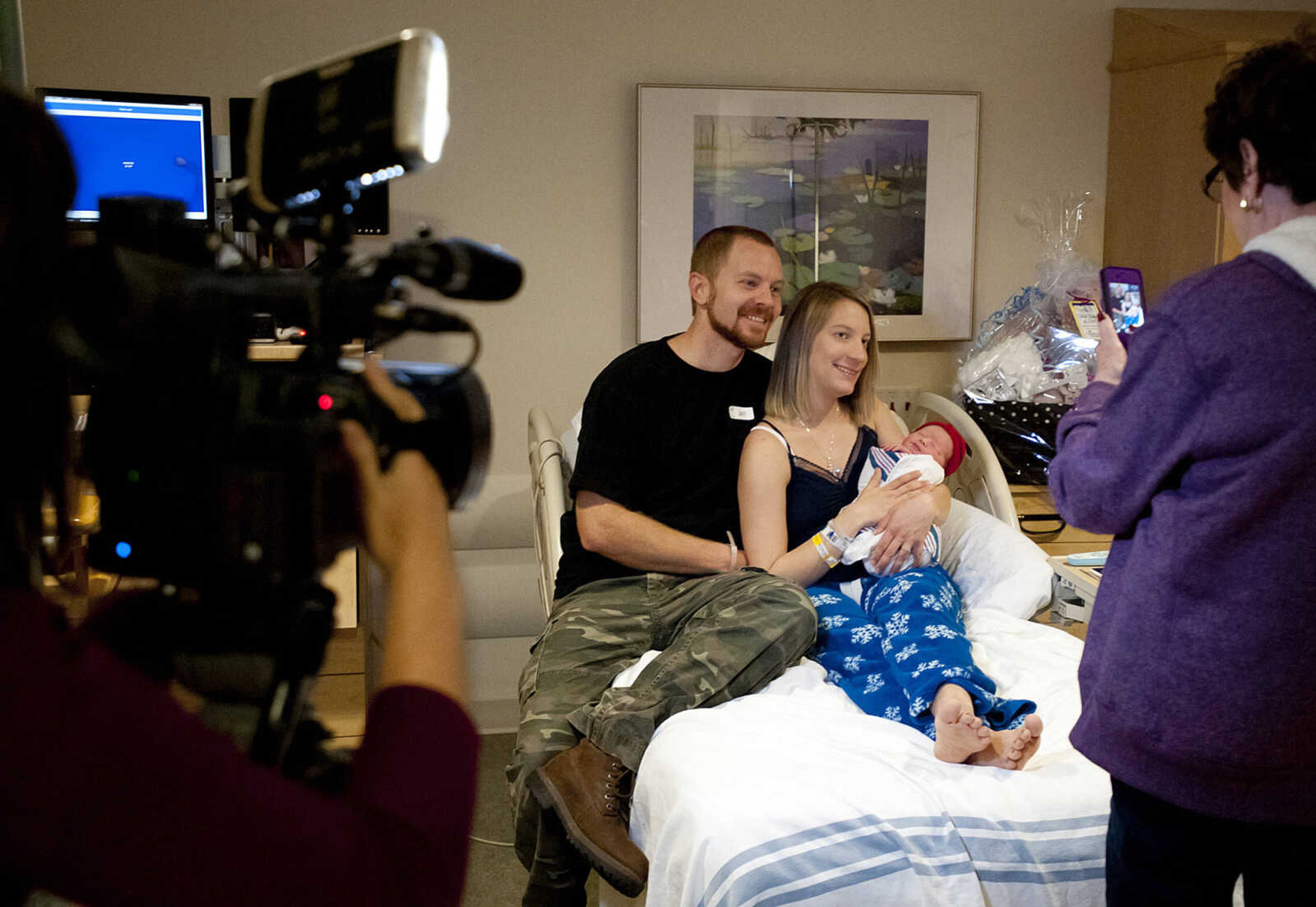 Adam, Leah and Tucker Isaiah Henley, who was born at 12:59 a.m. Wednesday, Jan. 1, pose for a photo at Southeast Hospital. Tucker weighs seven pounds, eleven ounces and wasn't due for a couple of more weeks. "Two and a half weeks early, he's healthy and we are extremely happy," said Leah. The couple have another son Chase, age three.