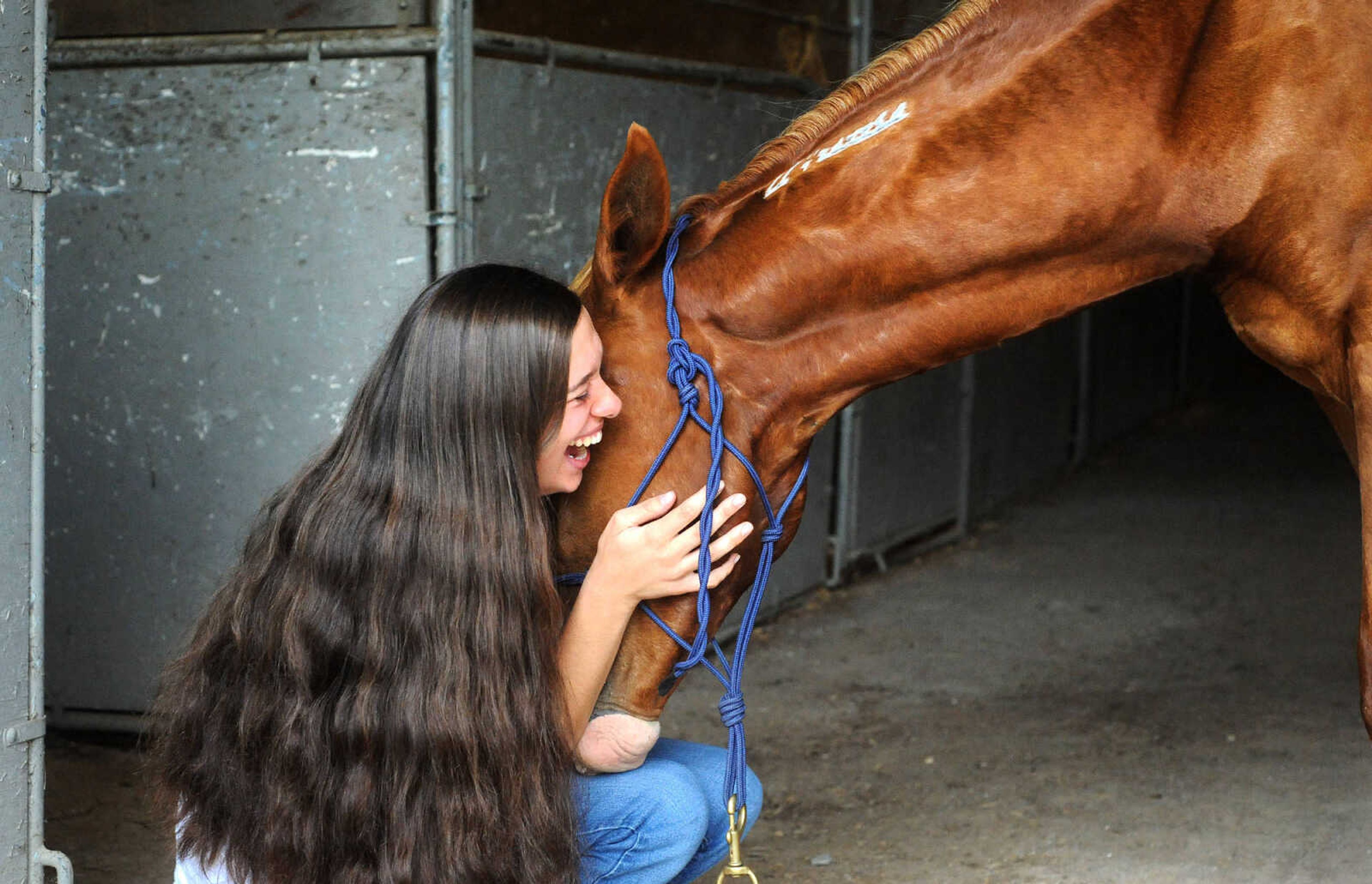 LAURA SIMON ~ lsimon@semissourian.com

Allison Elfrink and her wild mustang, Chico, at Flickerwood Arena in Jackson, Missouri, Wednesday, Aug. 5, 2015.