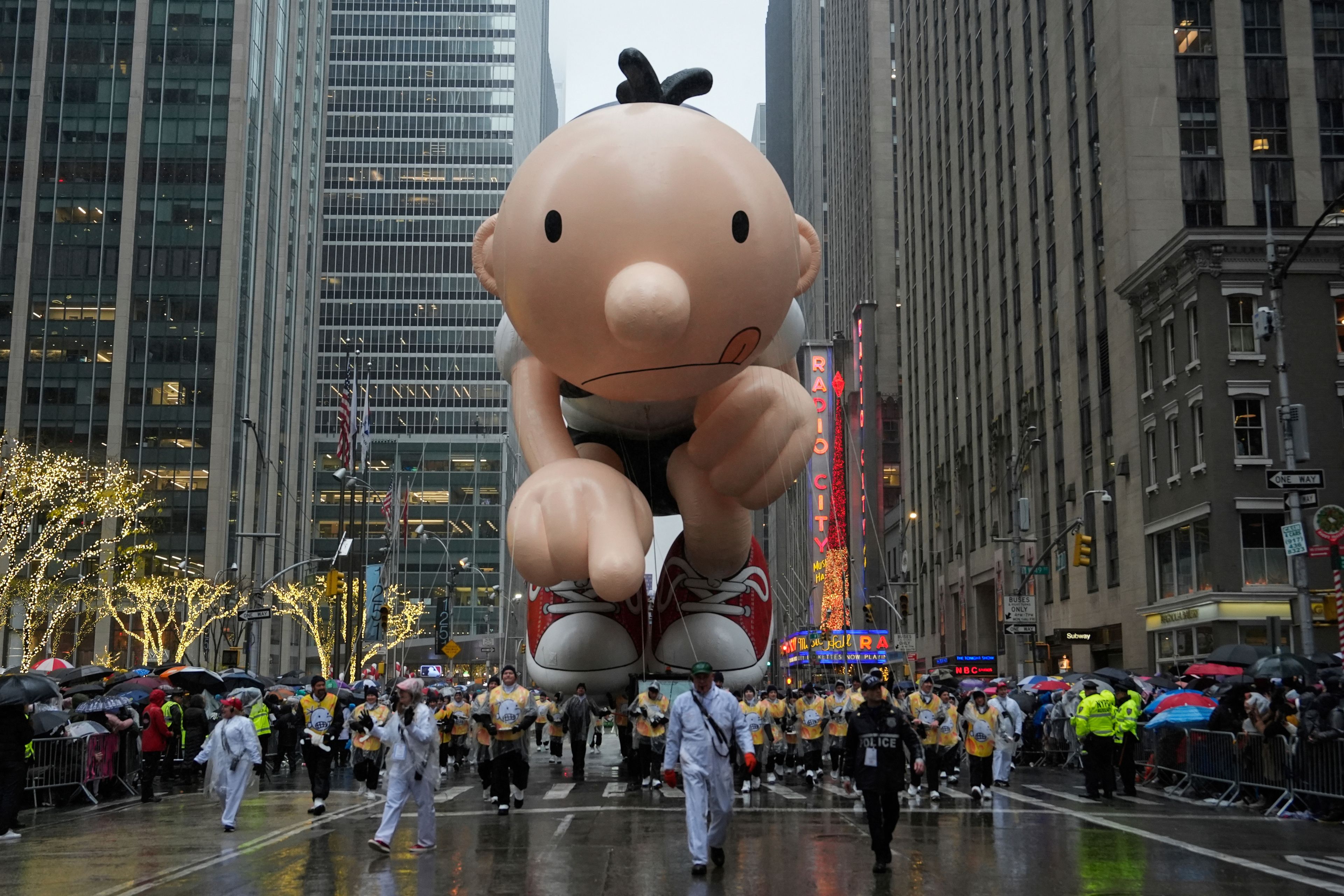 Handlers guide the Greg Heffley balloon down Sixth Avenue during the Macy's Thanksgiving Day Parade, Thursday, Nov. 28, 2024, in New York. (AP Photo/Julia Demaree Nikhinson)