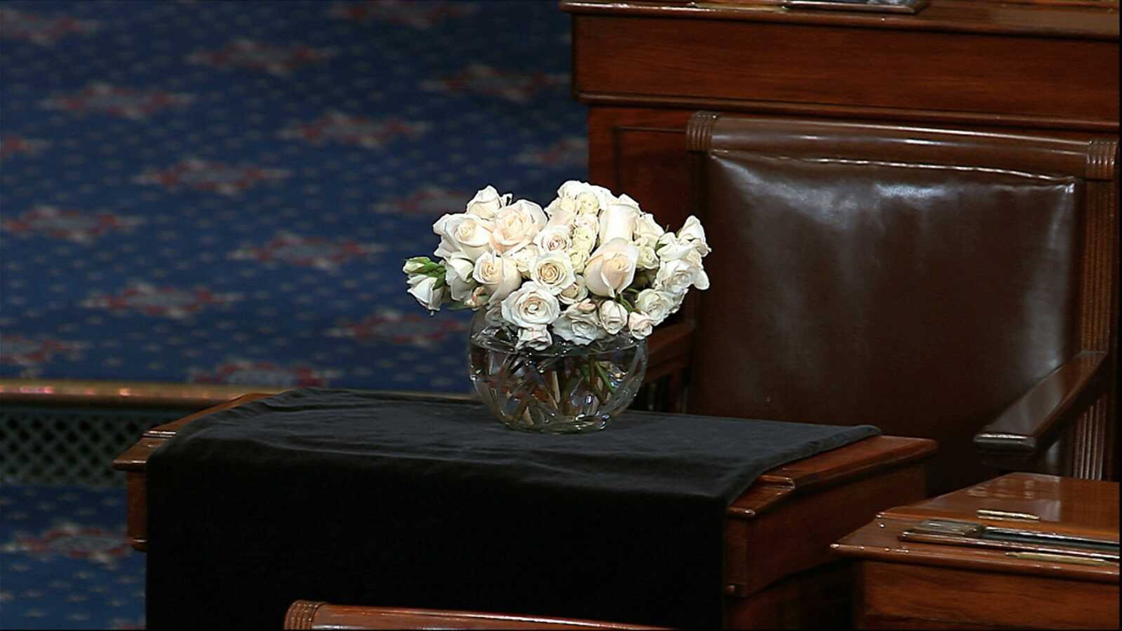 The desk of Sen. John McCain, R-Ariz., is draped in black Monday on the floor of the U.S. Senate. McCain died Saturday at the age of 81 after battling brain cancer.