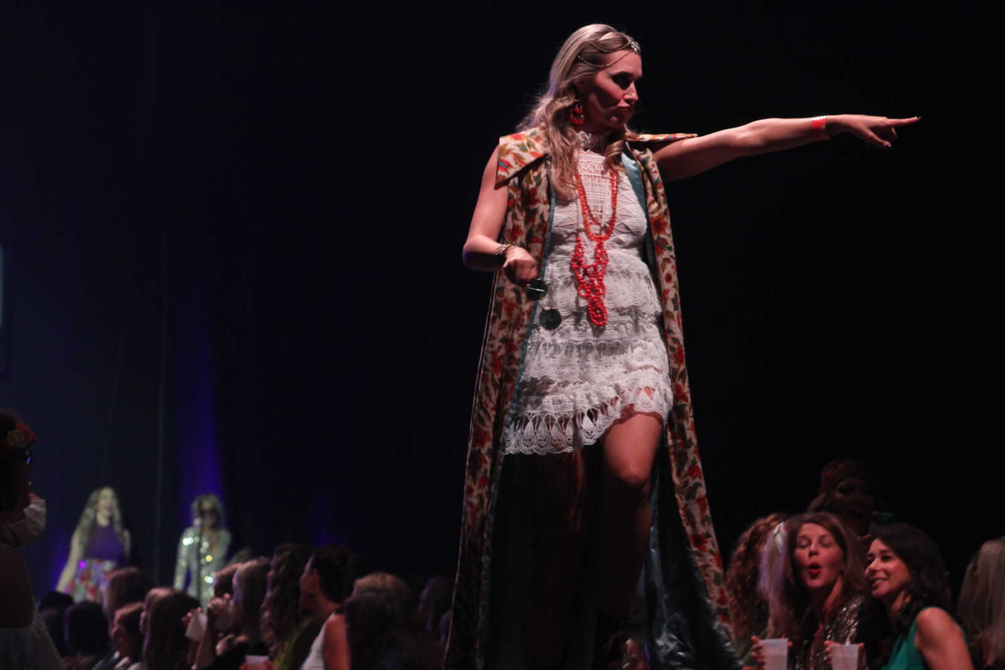 Community women perform as models and dancers in the 11th VintageNOW fashion show Saturday, Oct. 9, 2021, at the Show Me Center in Cape Girardeau.