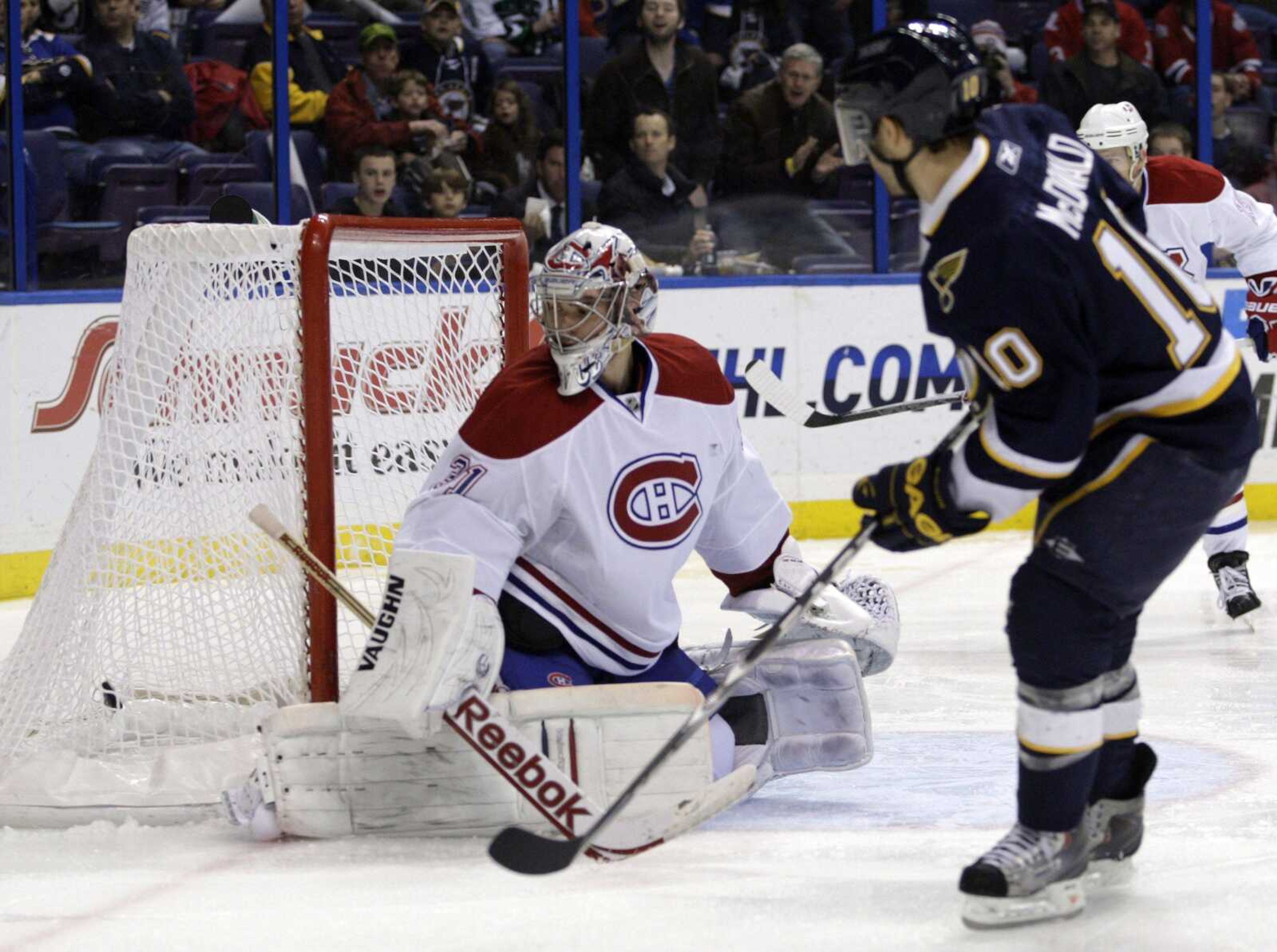 St. Louis Blues' Andy McDonald (10) shoots the puck past Montreal Canadiens goalie Carey Price (31)to score during the second period of an NHL hockey game, Thursday, March 10, 2011 in St. Louis.(AP Photo/Tom Gannam)