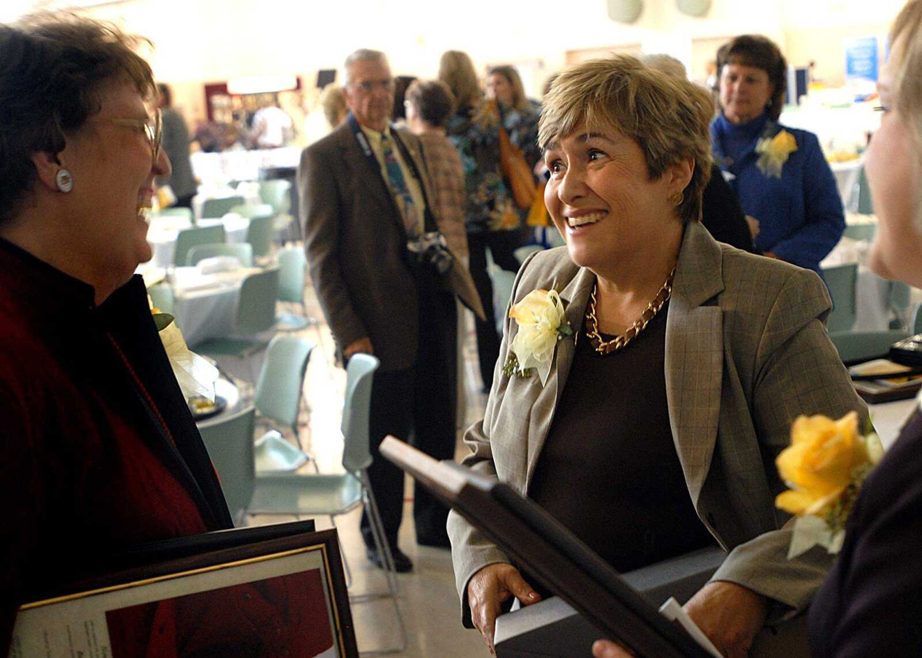 Denise Stewart, right, winner of the Women of Achievement Award from the Zonta Club, talks with fellow nominee Jane Jackson after Friday's award ceremony at the Osage Community Centre.

AARON EISENHAUER ~ aeisenhauer@ semissourian.com