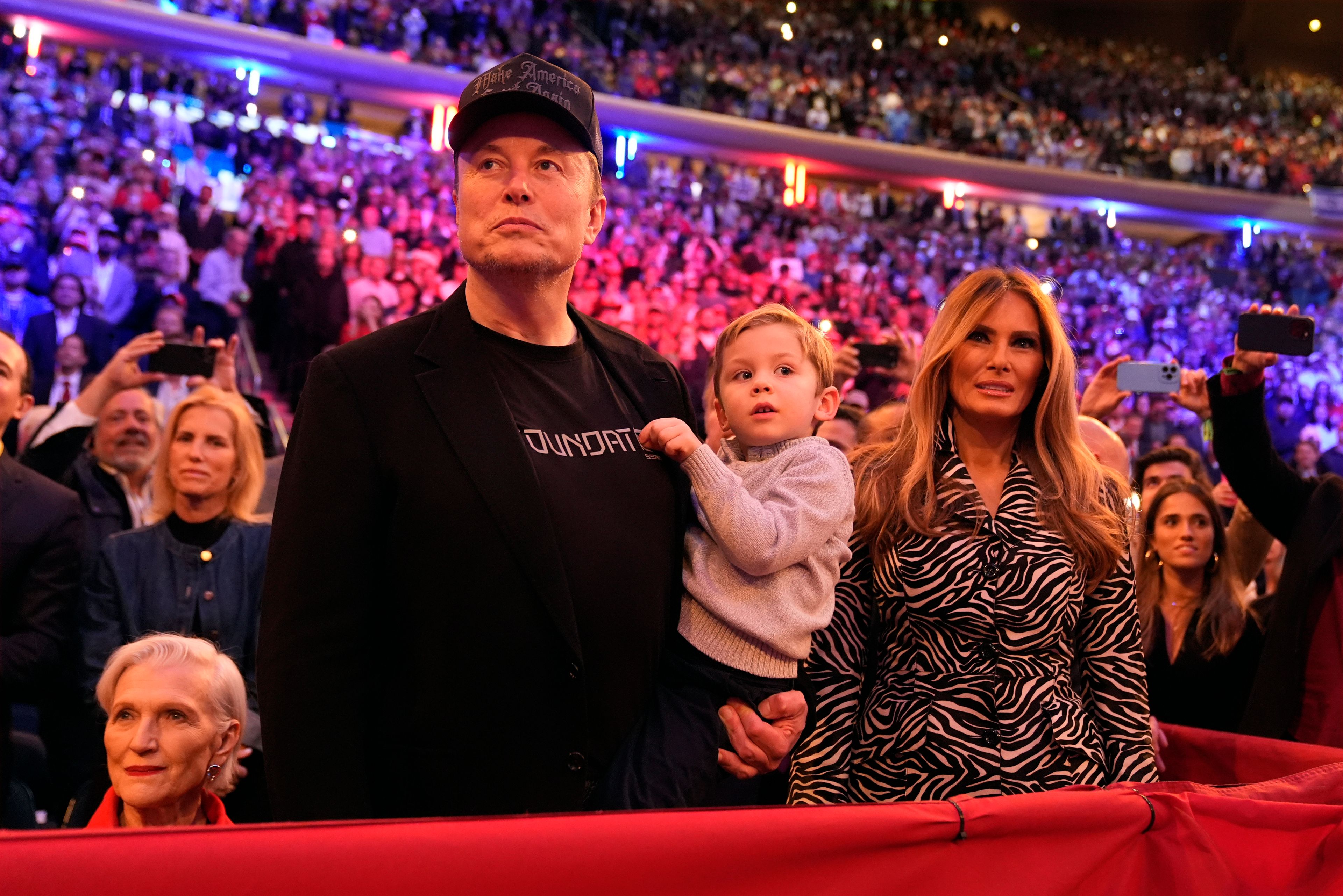 Elon Musk and former first lady Melania Trump listen as Republican presidential nominee former President Donald Trump speaks at a campaign rally at Madison Square Garden, Sunday, Oct. 27, 2024, in New York. (AP Photo/Alex Brandon)