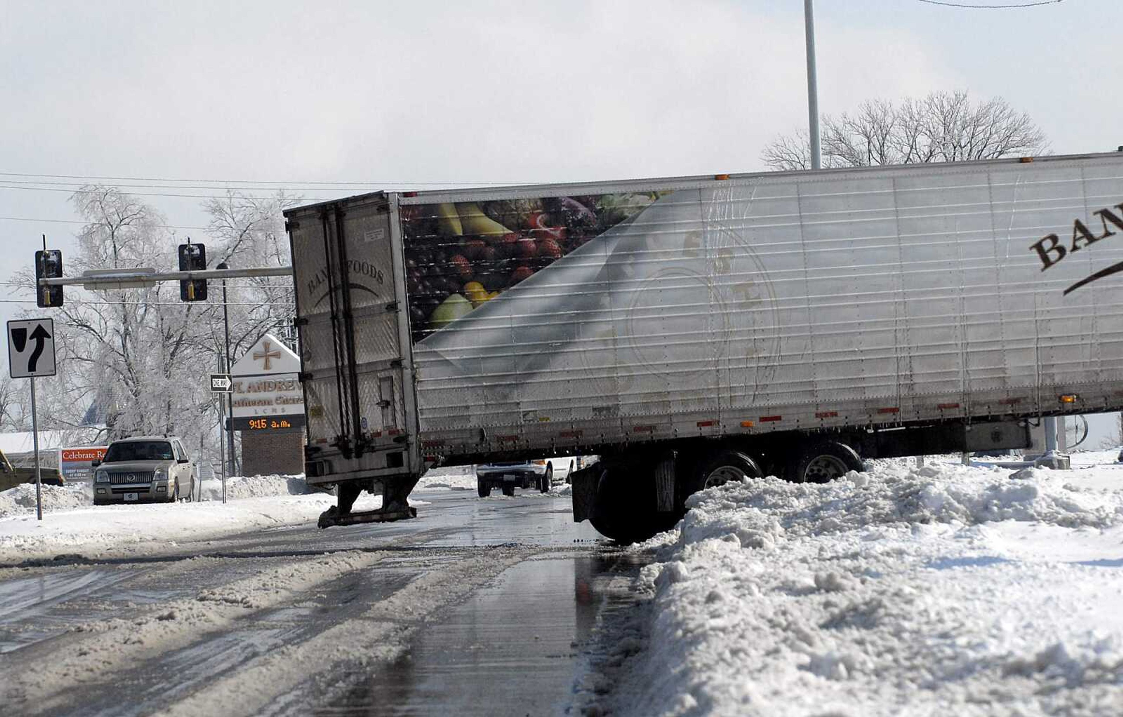 ELIZABETH DODD ~ edodd@semissourian.com
A semi-trailer truck blocks traffic on Kingshighway after becoming stuck turning into Andy's Custard in Cape Girardeau.