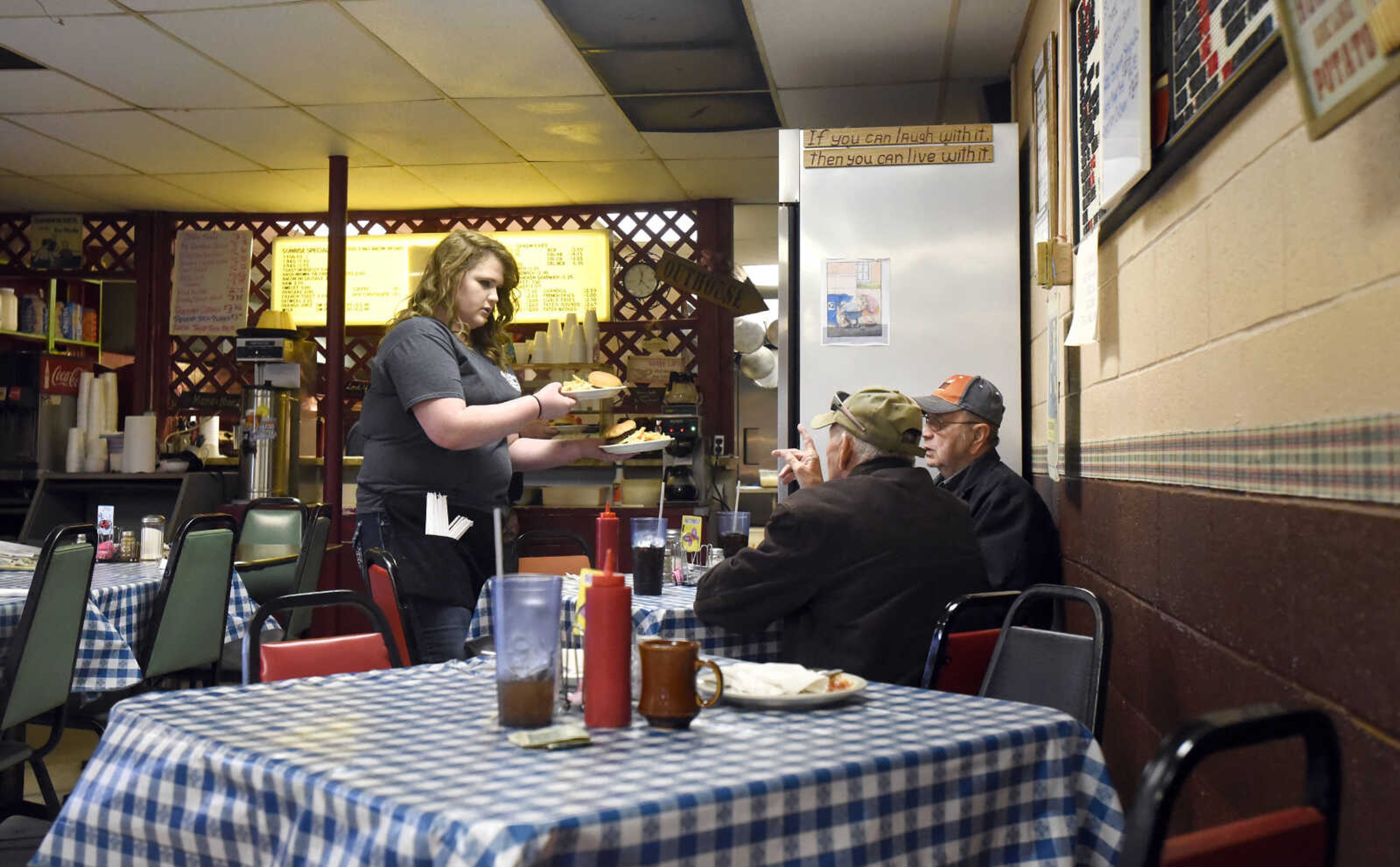 Elizabeth Robison delivers a lunch order on Monday, March 27, 2017, at Bonnie's Moo Cow Cafe in Patton, Missouri.