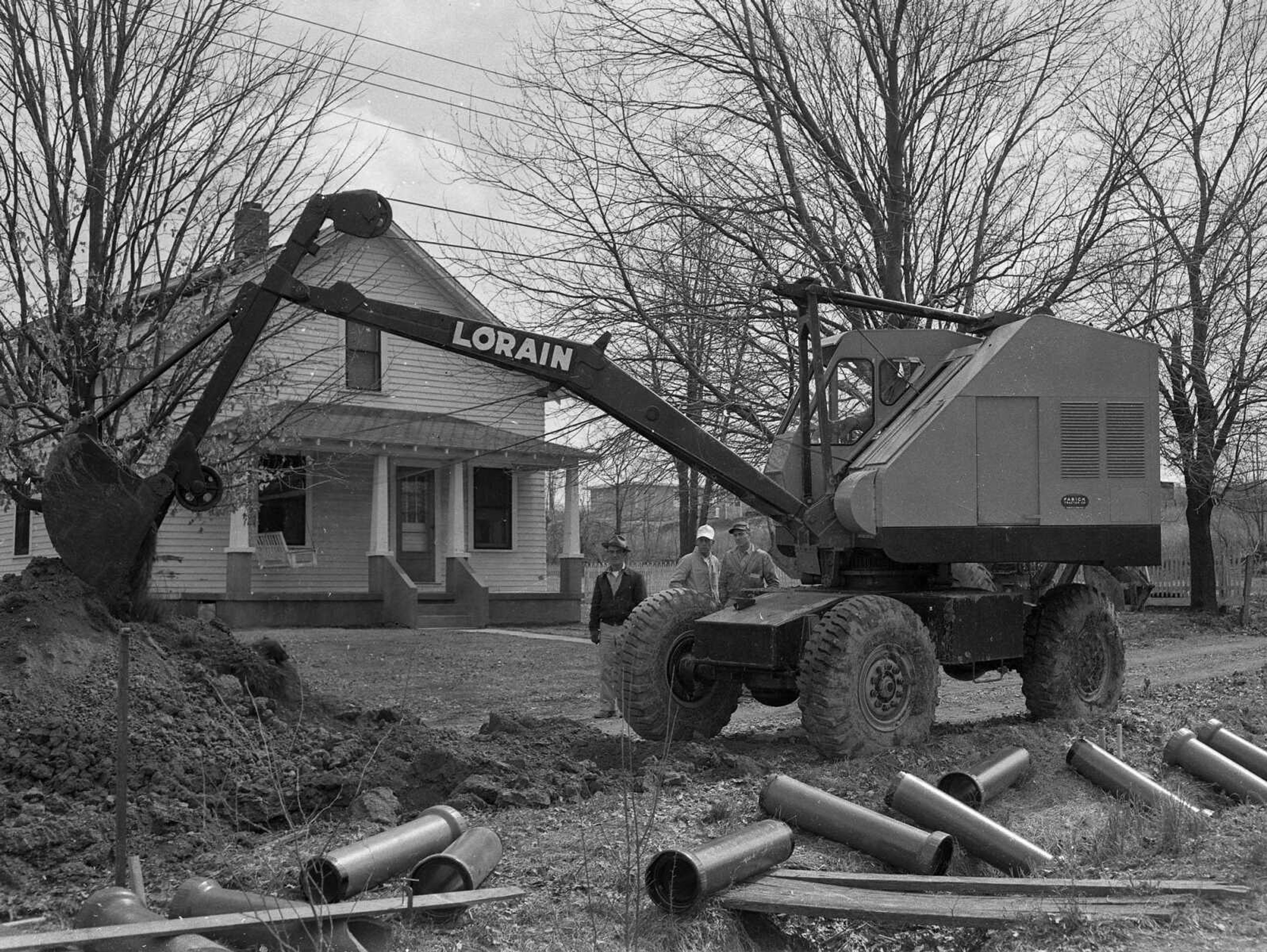 Workers dig a ditch for a sewer line in this unidentified photograph.