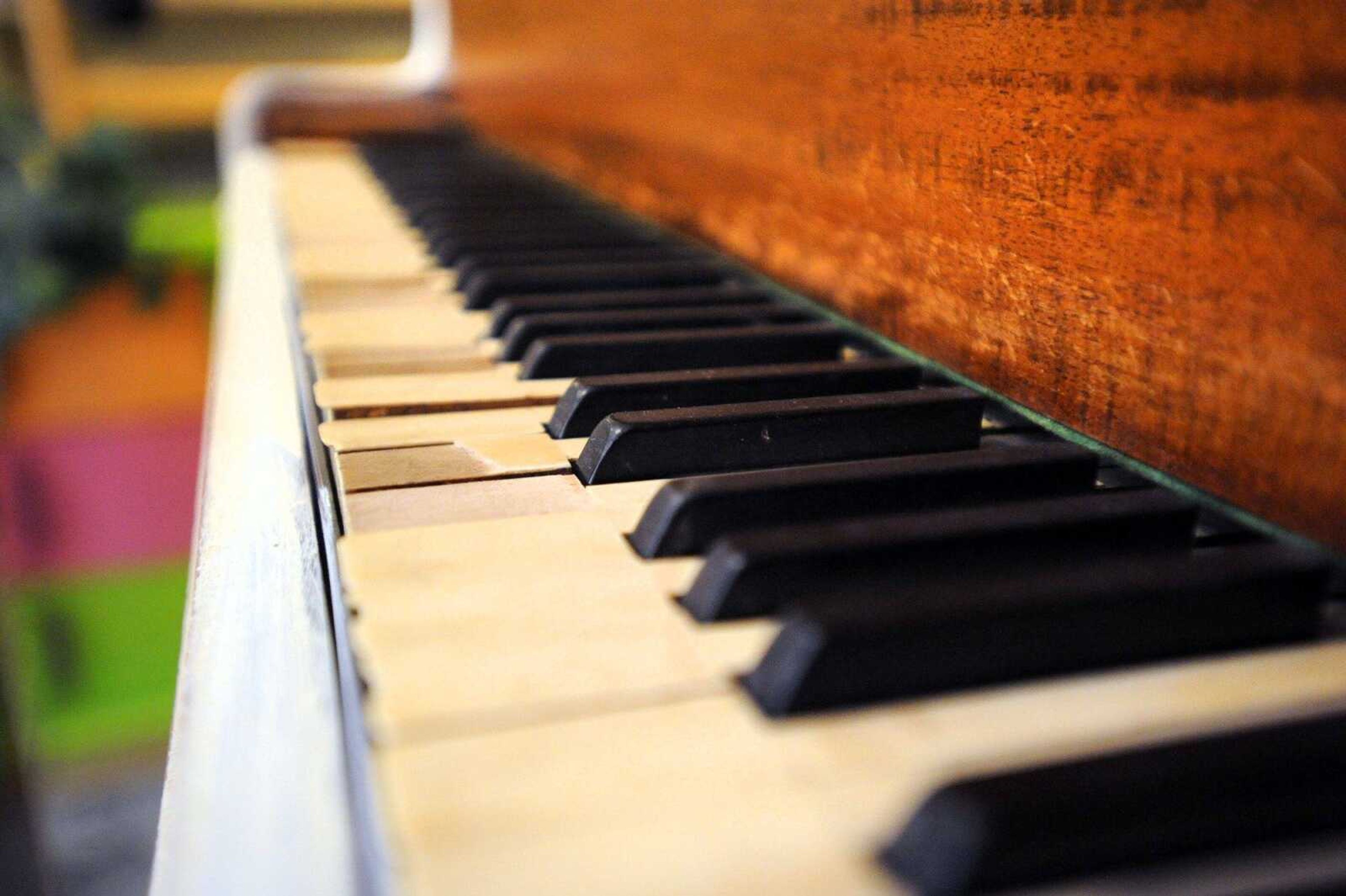 Susan Hall is repurposing an old piano for a client at Shoppe La La. (Laura Simon)