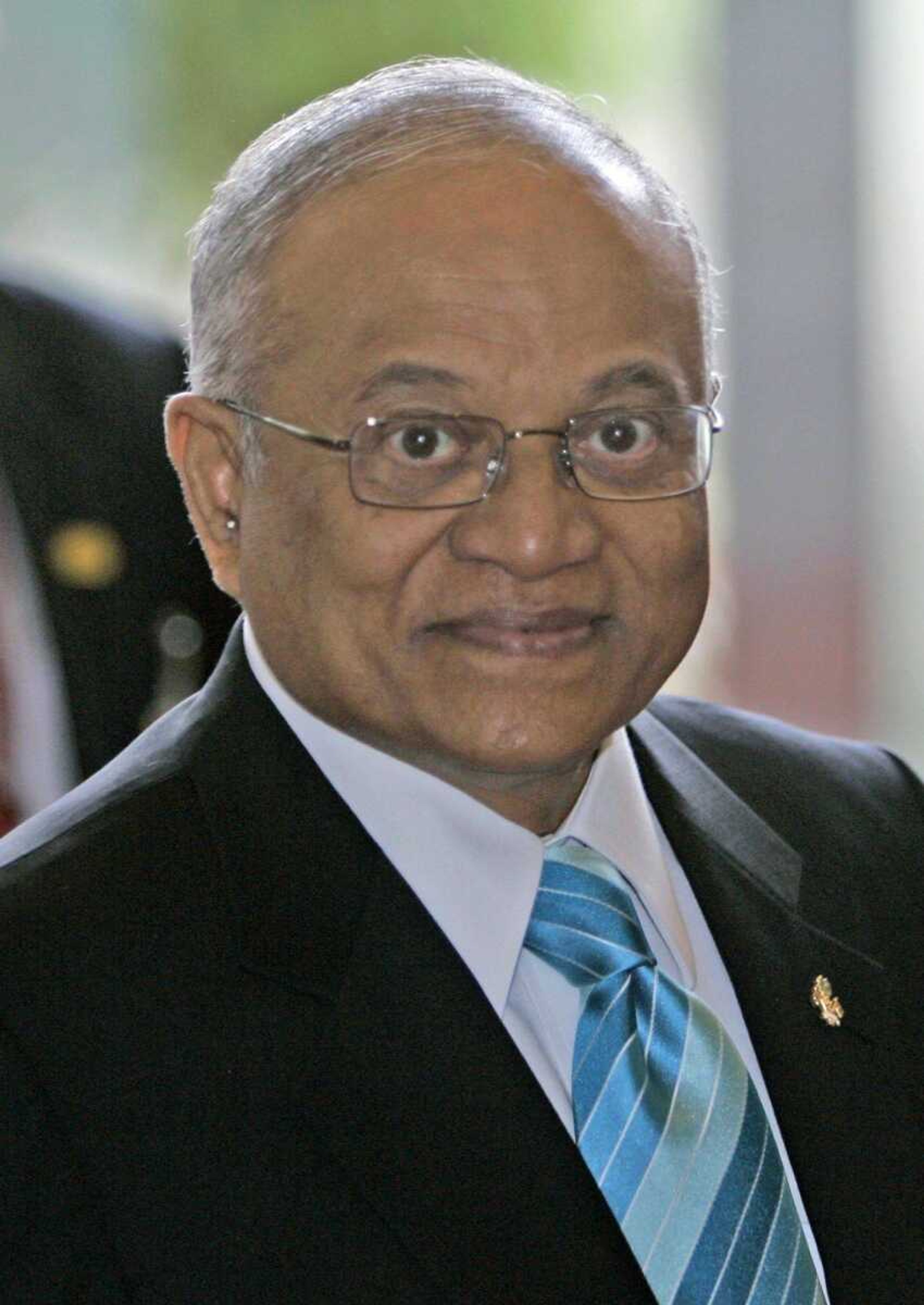 Maldives' President Maumoon Abdul Gayoom arrives to attend the UN climate conference in Nusa Dua on Bali island, Indonesia, in this Wednesday, Dec. 12, 2007 photo. Gayoom survived an assassination attempt Tuesday January 8, 2008, when a teenage boy grabbed the knife of an attacker who jumped out of a crowed of people greeting the president, an official said. (AP Photo/Dita Alangkara)