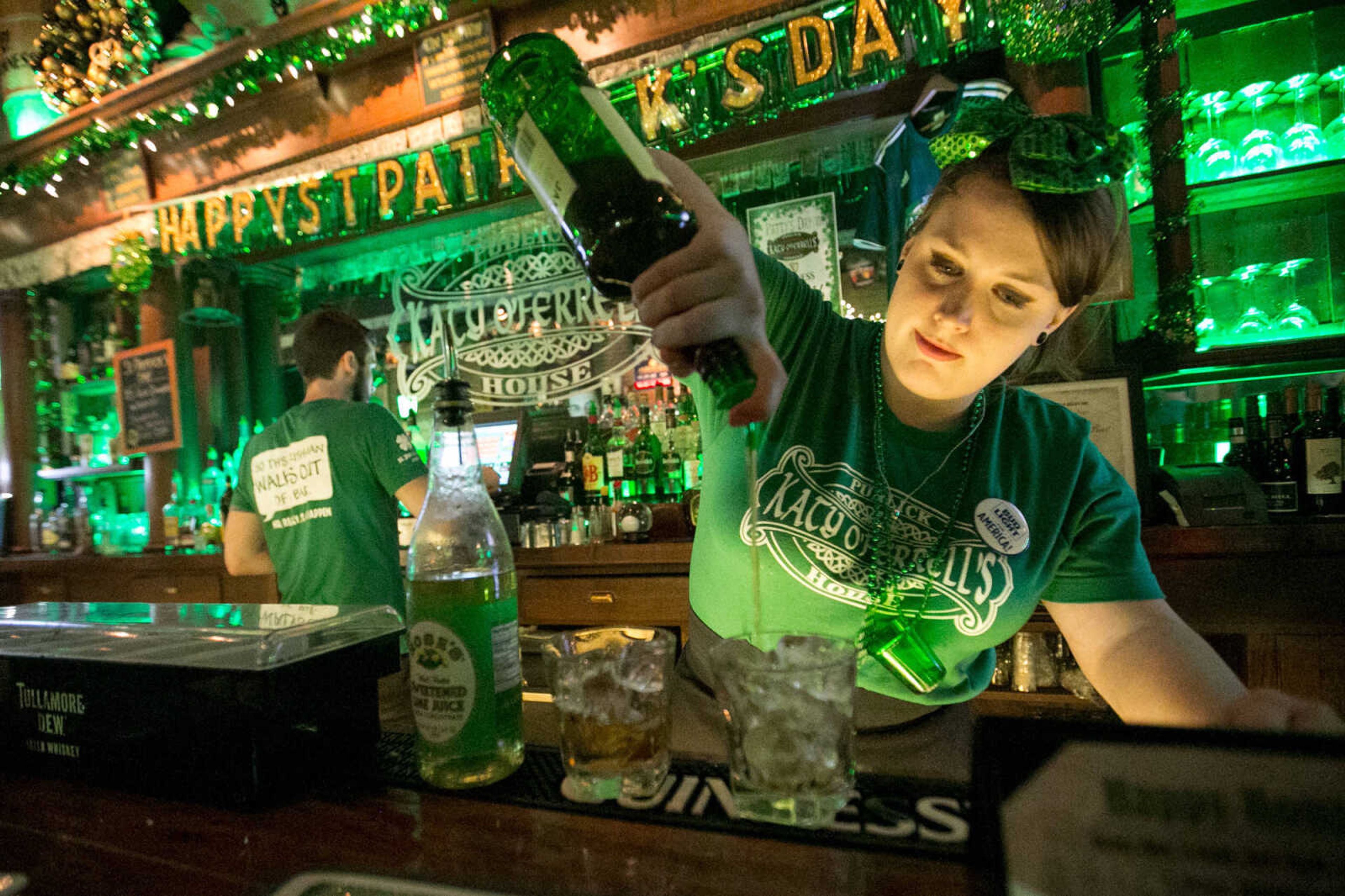 GLENN LANDBERG ~ glandberg@semissourian.com

Shawna Schweain pours a pair of Irish Buck cocktails  at Katy O'Ferrell's Publick House during the St. Patrick's Day Pub Crawl in downtown Cape Girardeau Thursday, March 17, 2016.