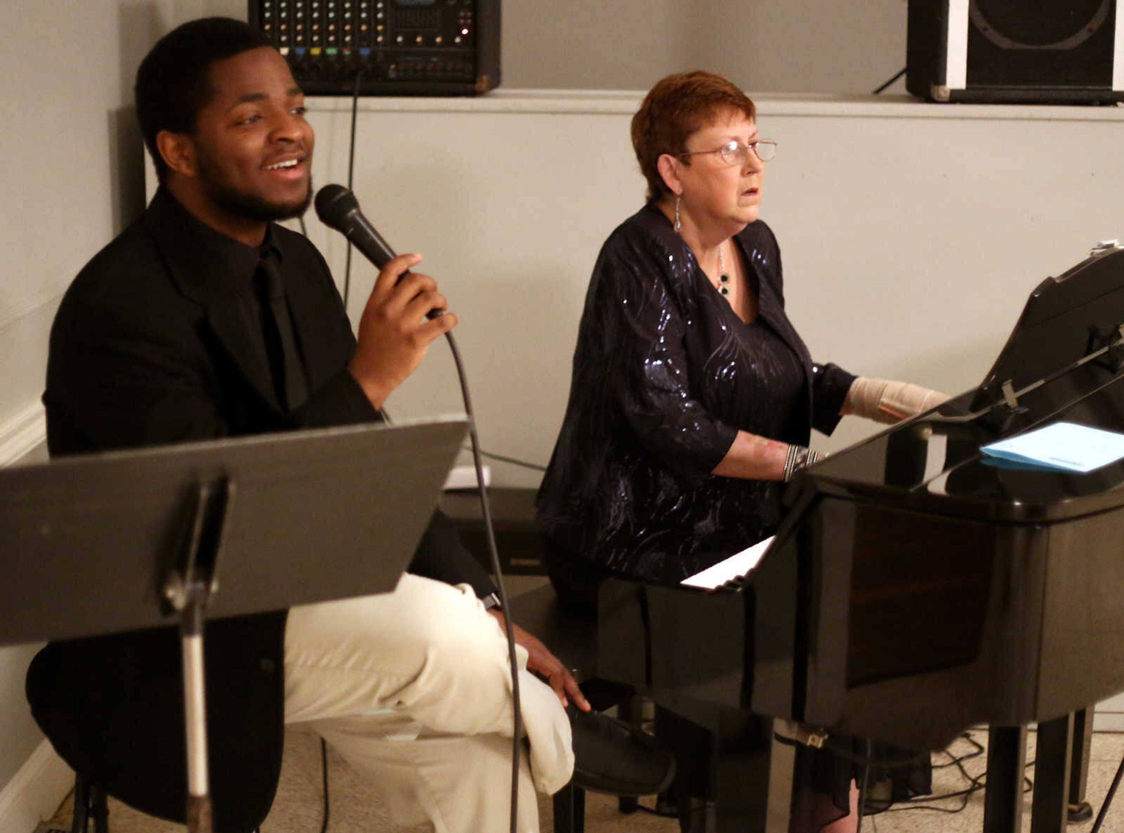 Brodrick Twiggs and Beverly Reece entertain guests with a performance of "Unchained Melody" by The Righteous Brothers during the Dingeldein Gala, hosted by the Arts Council of Southeast Missouri on February 17, 2017 at the Cape Girardeau Country Club.