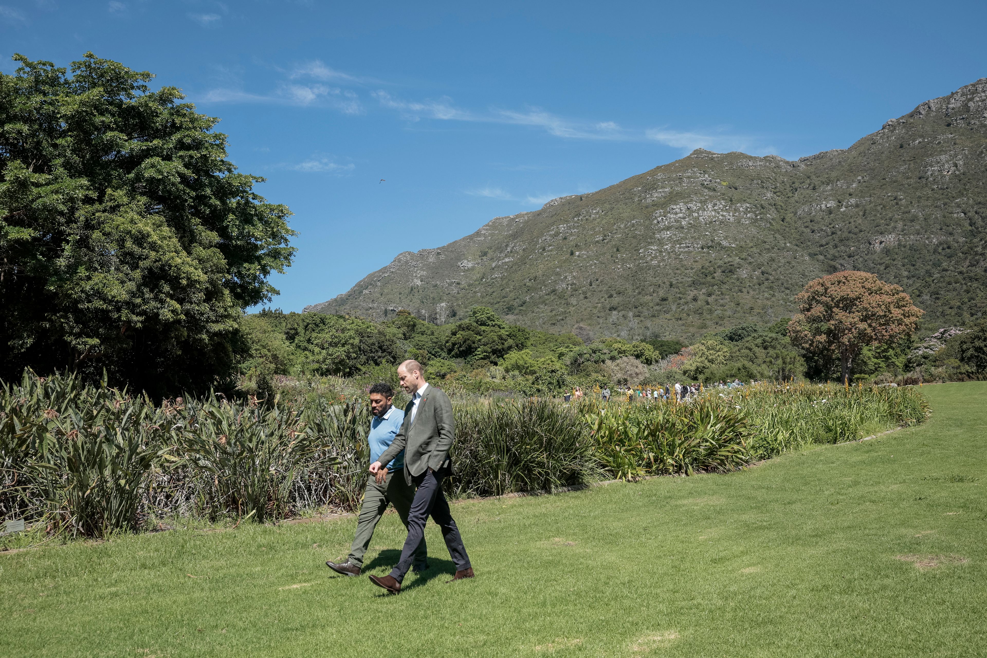 Britain's Prince William, Prince of Wales, right, walks with Garden Director Werner Voigt before a meeting with the 2024 Earthshot Prize Finalists, at Kirstenbosch National Botanical Garden in Cape Town, South Africa, Wednesday, Nov. 6, 2024. (Gianluigi Guercia, Pool Photo via AP)