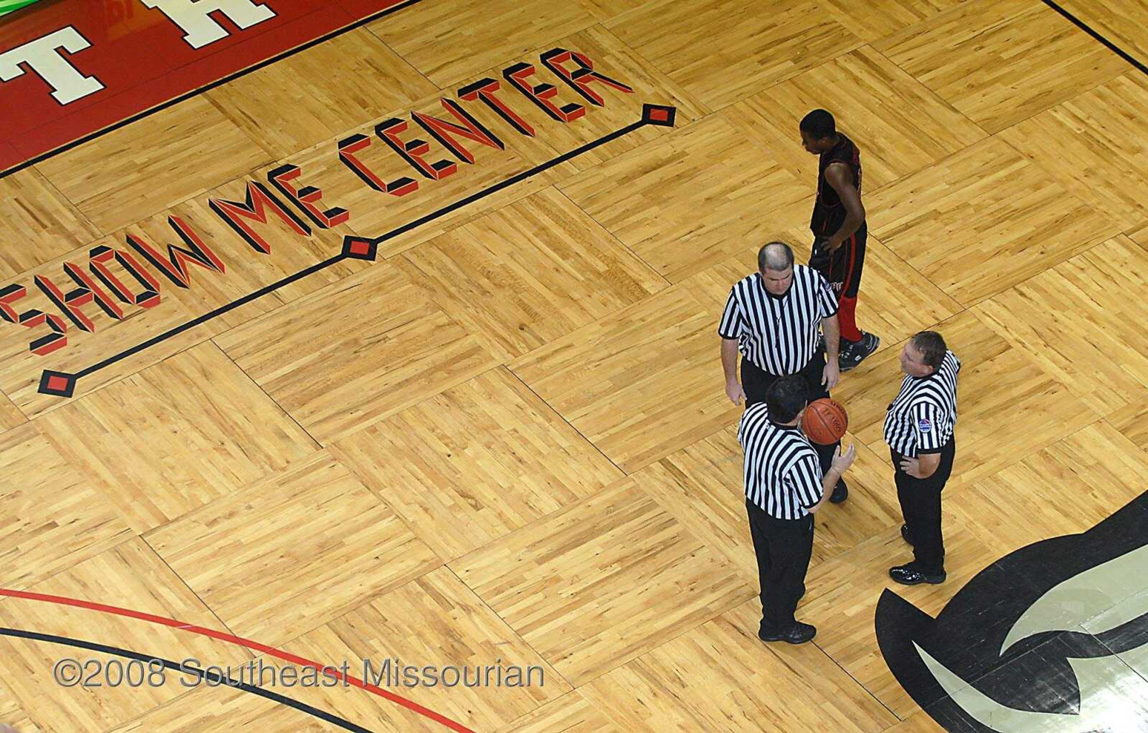 KIT DOYLE ~ kdoyle@semissourian.com
Referees huddle Tuesday, December 30, 2008, during the Southeast Missourian Christmas Tournament at the Show Me Center.