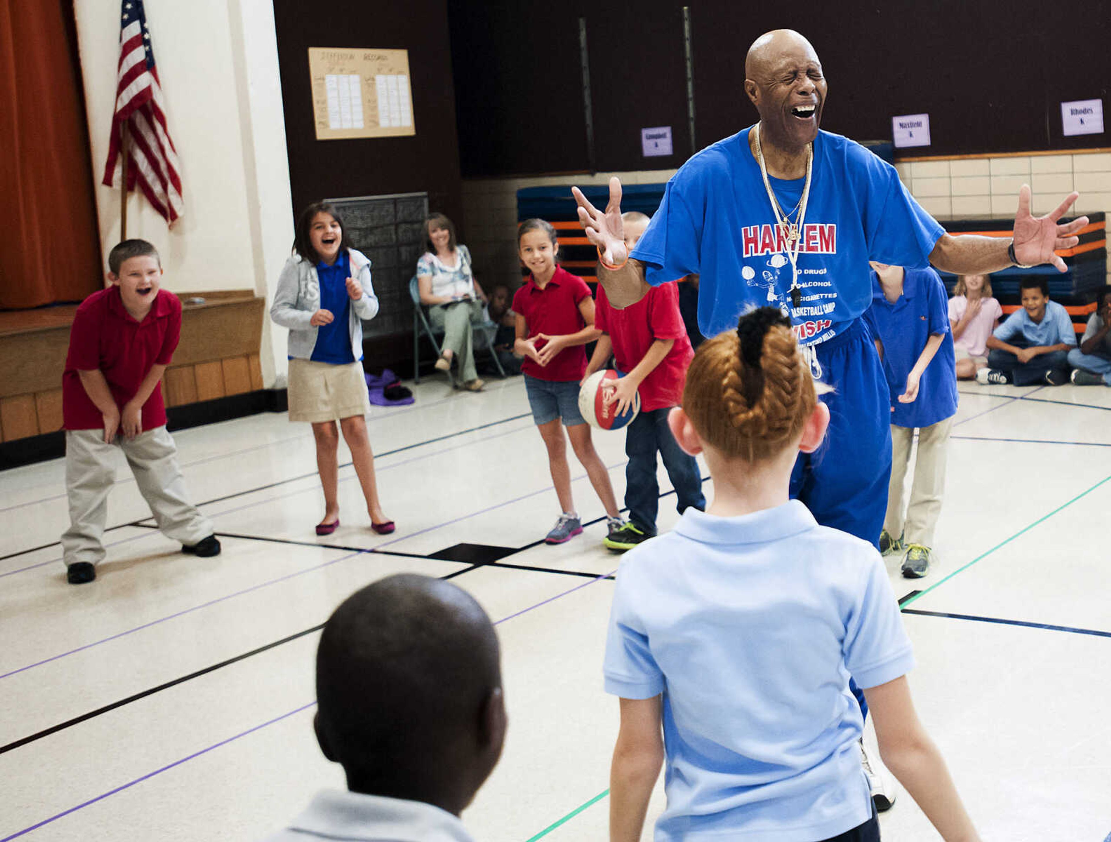 Captain "Magic" Valentino Willis plays a game with the students at Jefferson Elementary School Tuesday, Sept. 24, in Cape Girardeau. Willis, who is with the Harlem Swish Comedic Basketball Team, used his basketball and comedy skills to encourage the students to not smoke, drink or do drugs while respecting their teachers, principals, coaches and each other.