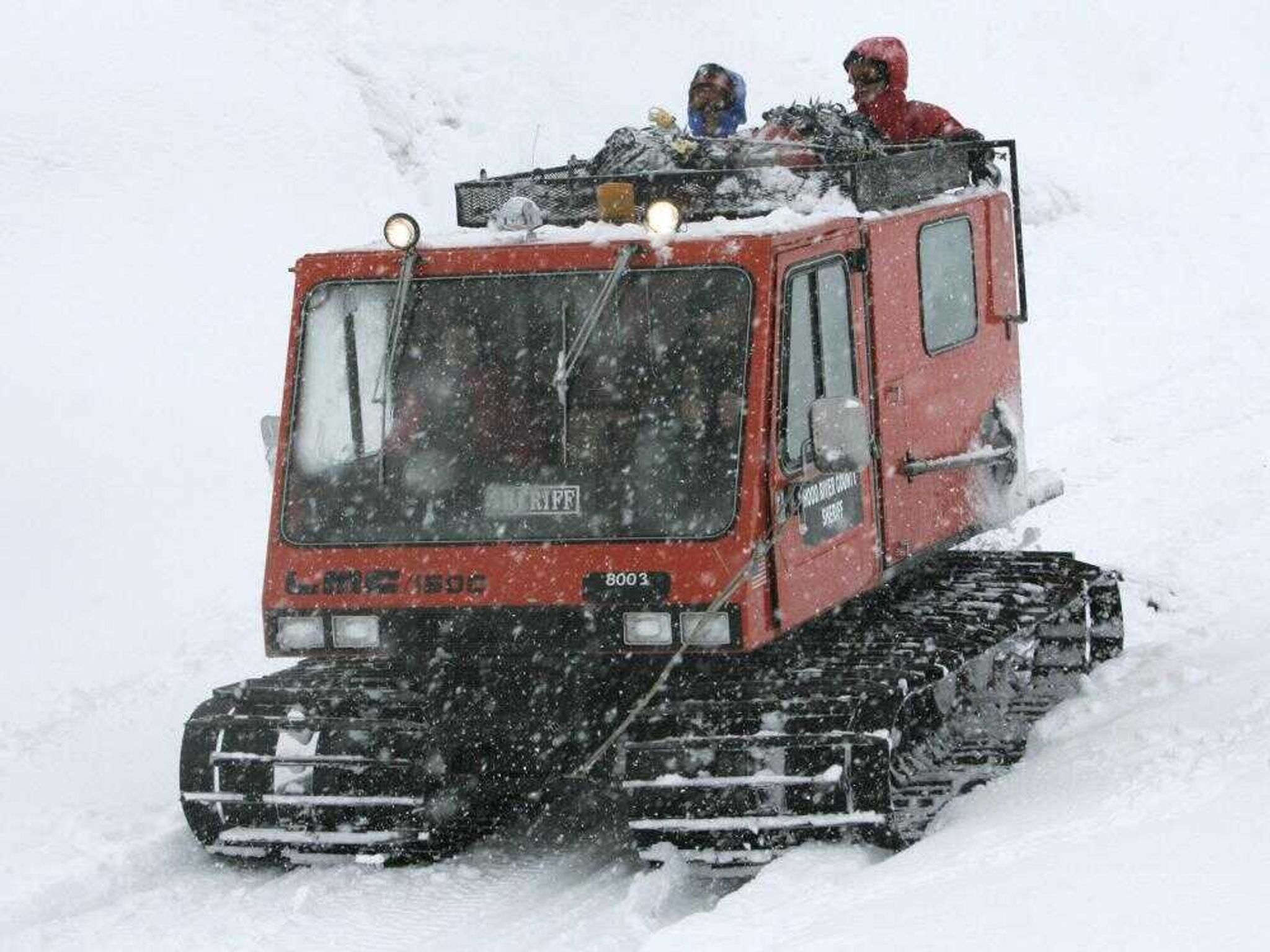 A snow-cat carried three climbers stranded on Mount Hood since Sunday as it came off the mountain.Don Ryan Associated Press