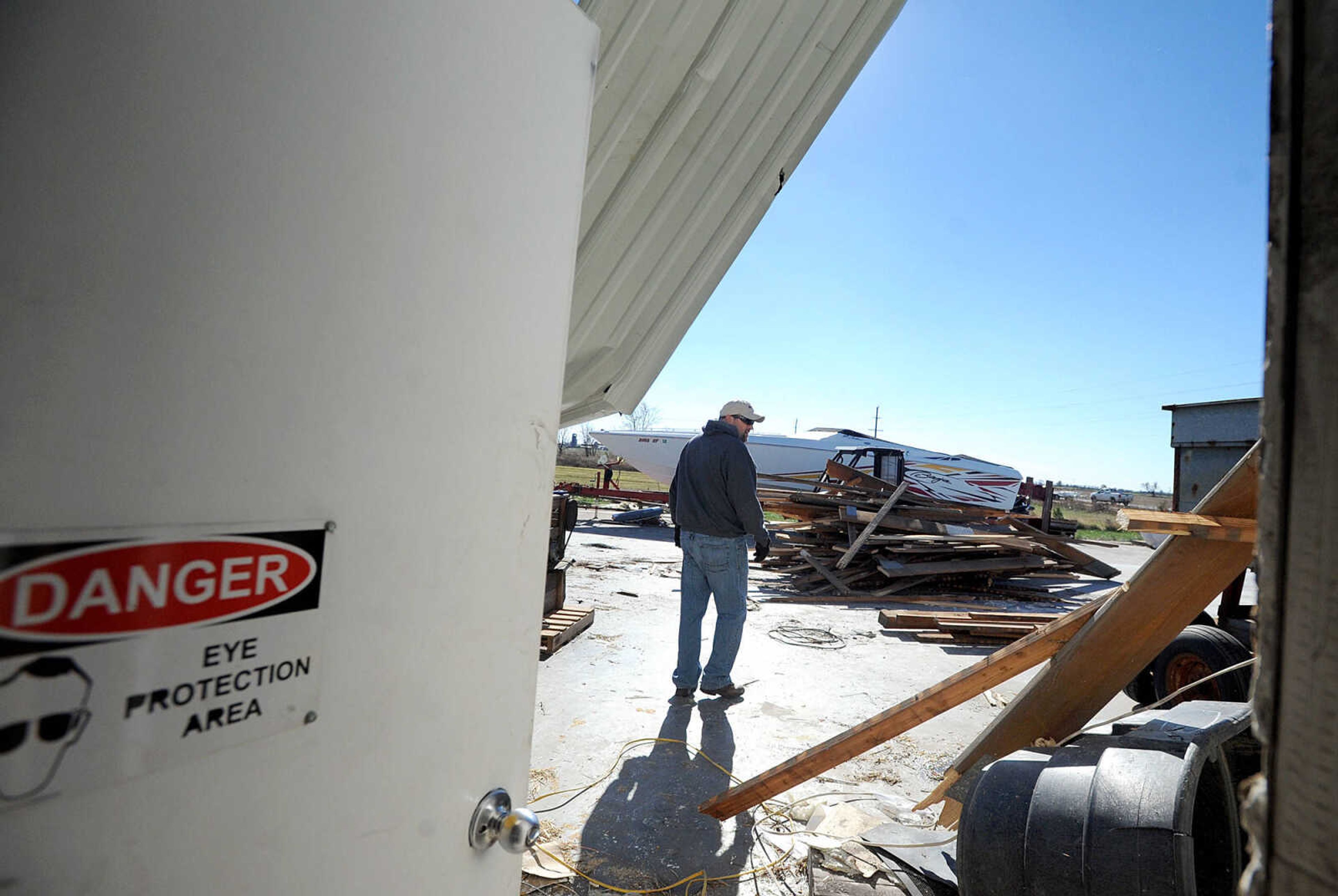 LAURA SIMON ~ lsimon@semissourian.com

Brad Cookson walks through the remnants of Cookson Seed, Monday, Nov. 18, 2013, just off U.S. 61 south of Morley, Mo. The family business was destroyed by Sunday's storm system that rolled though the area.