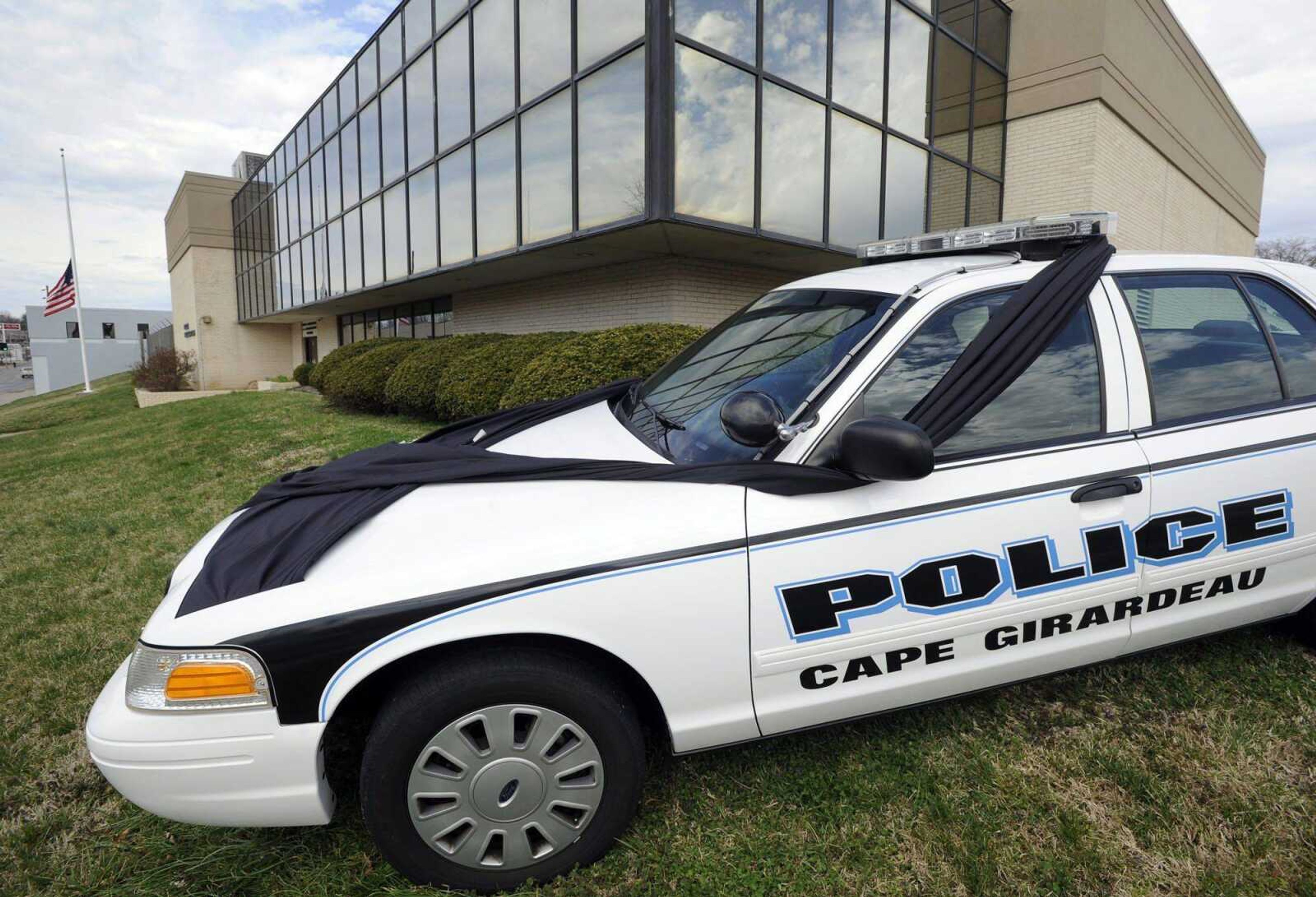 A police cruiser is draped in black Monday in memory of assistant chief Roger Fields, who died Sunday in Cape Girardeau. (Fred Lynch)