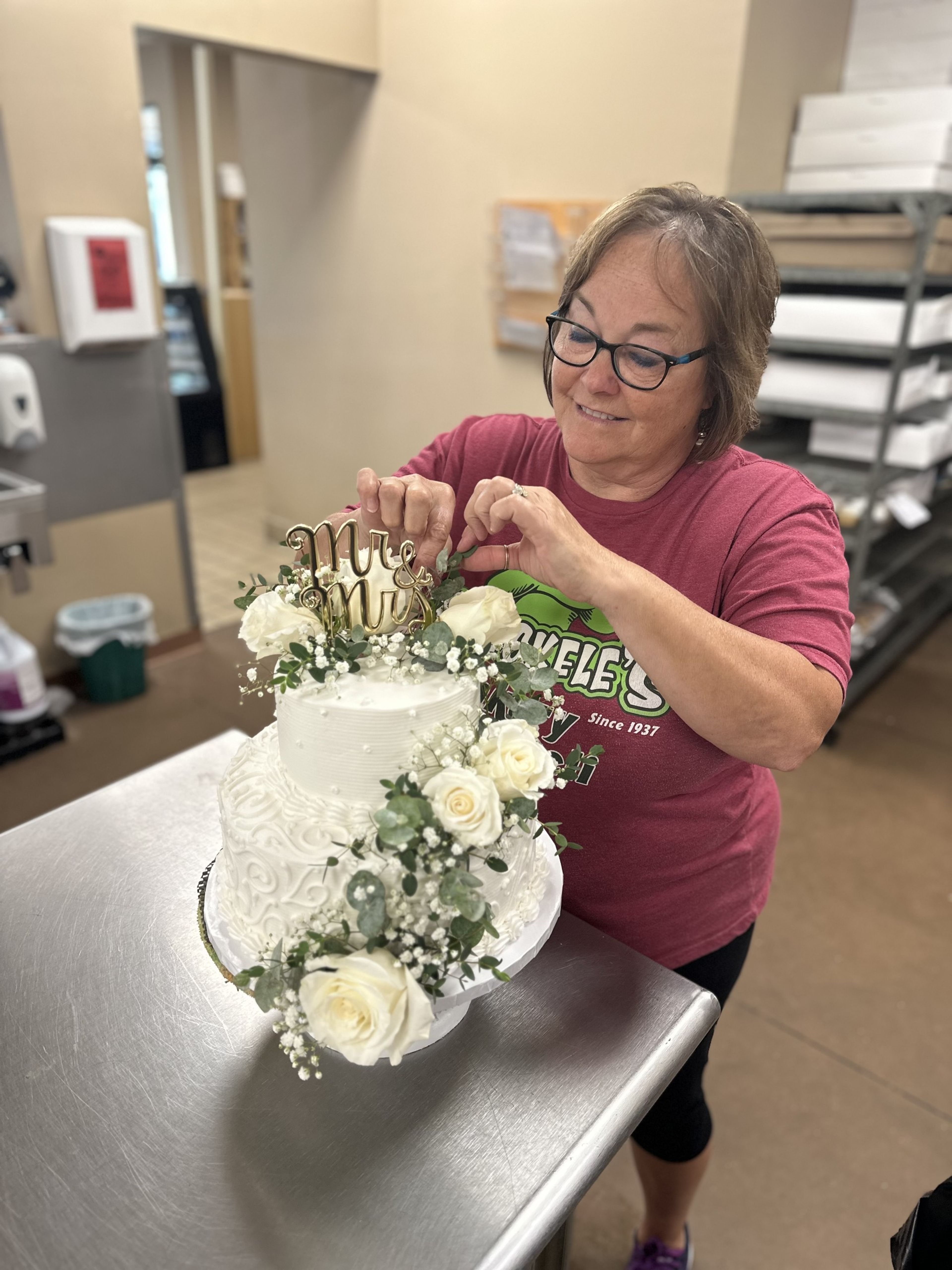 Angie Hoeckele decorates a cake at Hoeckele Bakery and Deli in Perryville. She and her husband have worked there for almost 40 years, and will retire in December. 