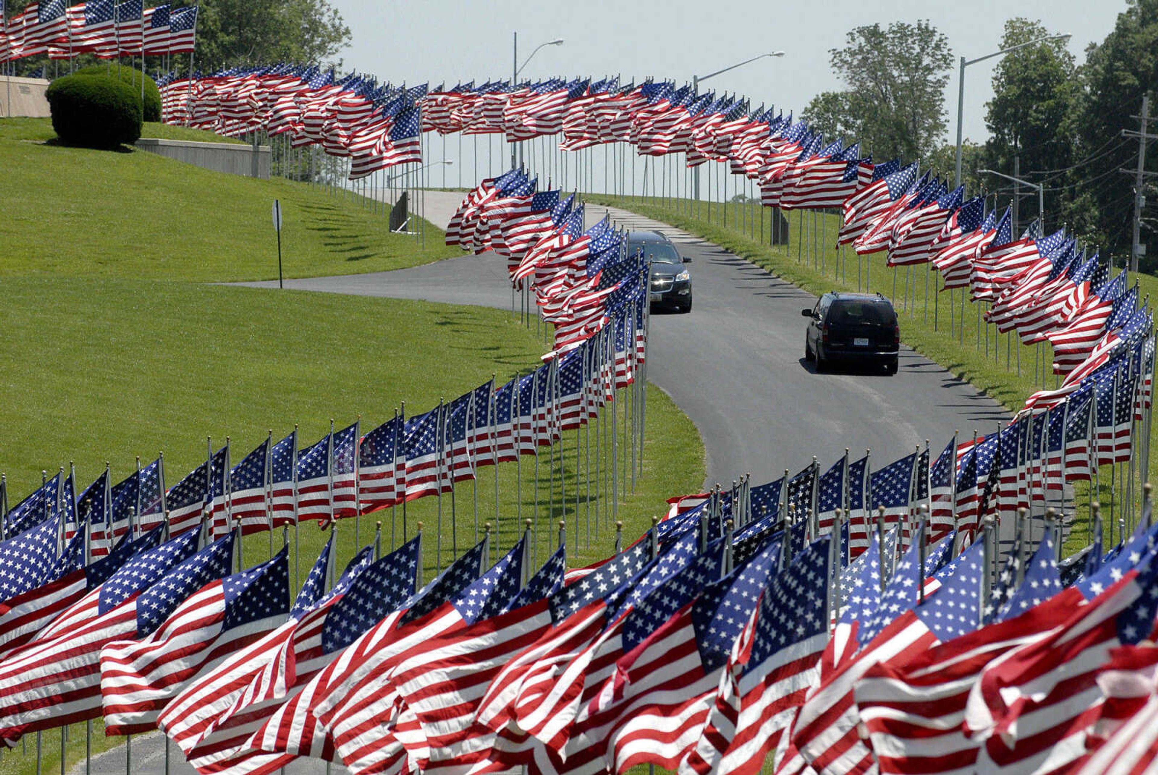 LAURA SIMON~lsimon@semissourian.com
Visitors pass through the Avenue of Flags Monday, May 30, 2011 at Cape County Park.