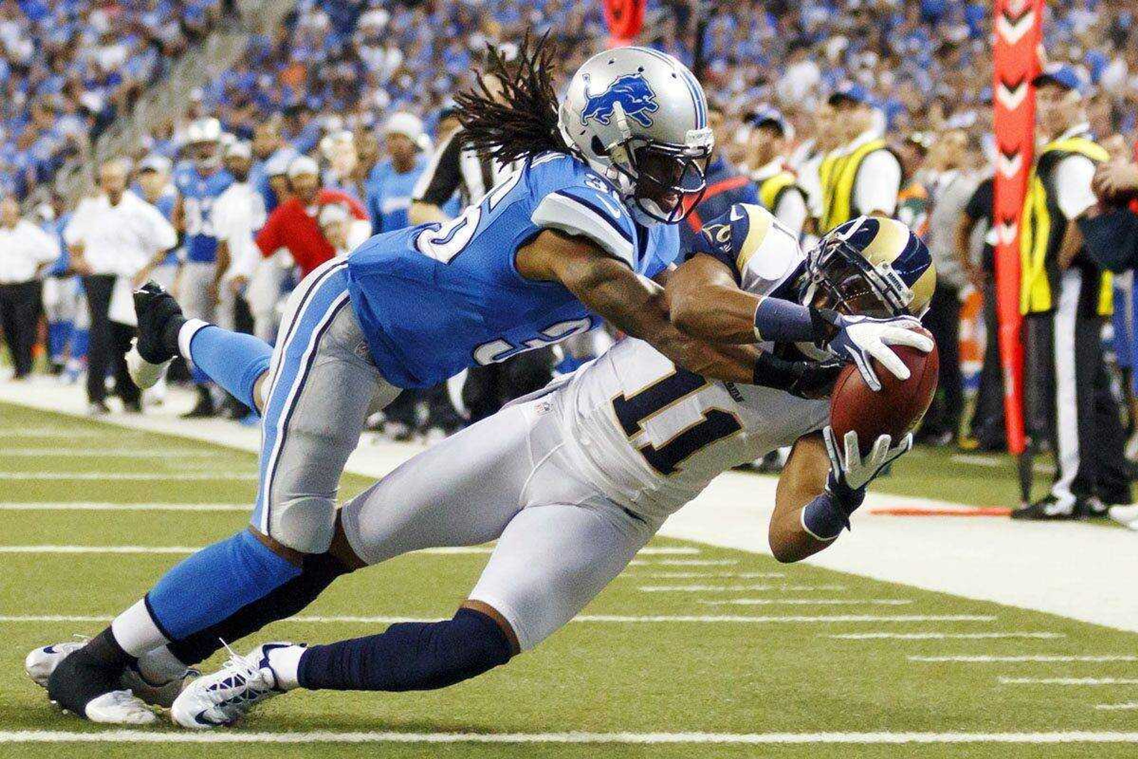 Rams receiver Brandon Gibson makes a touchdown reception as Lions cornerback Jonte Green defends during the fourth quarter Sunday in Detroit. The Rams lost 27-23. (Rick Osentoski ~ Associated Press)