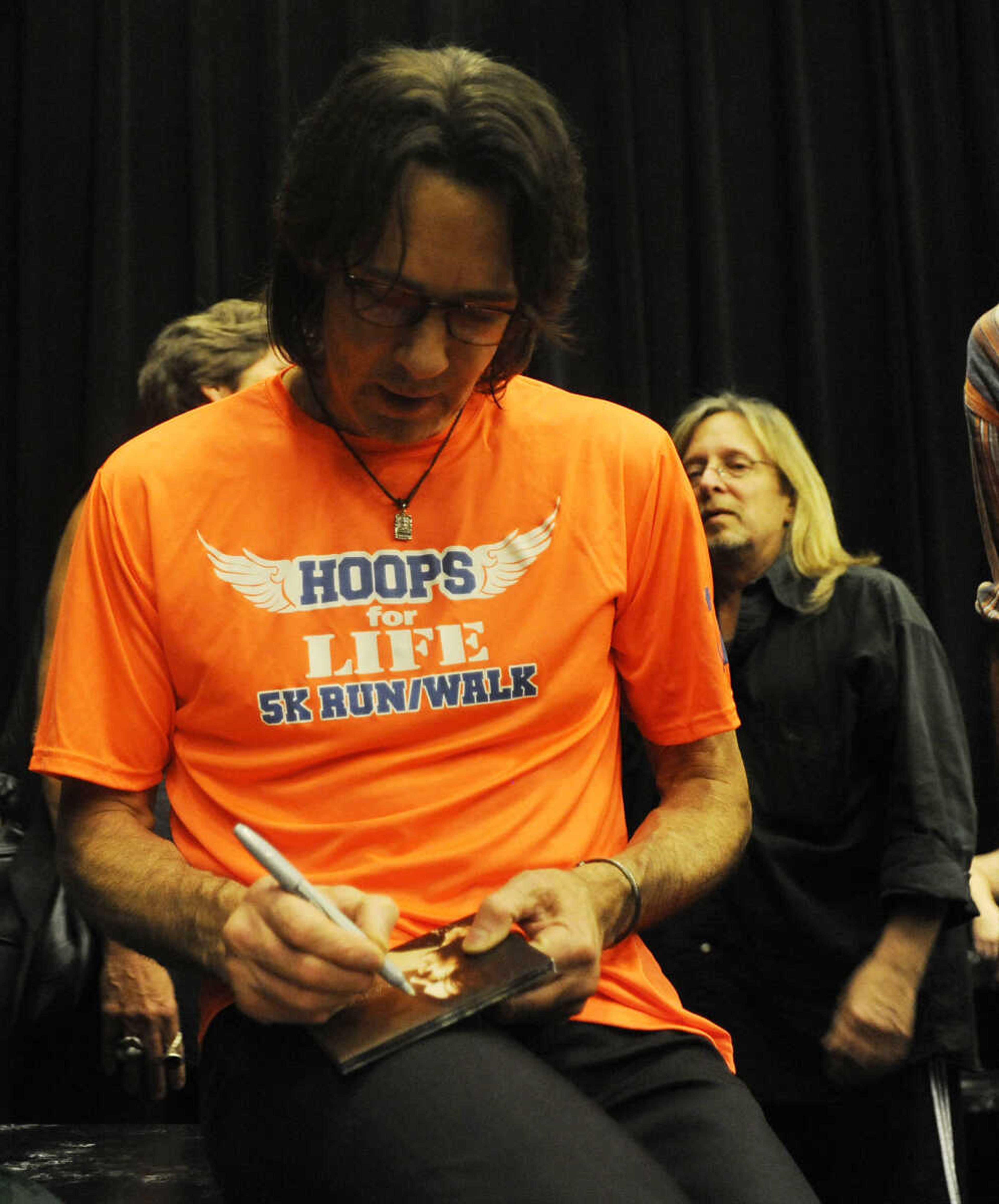 Rick Springfield signs autographs Saturday, July 21, after performing at the Bedell Performance Hall at the River Campus as part of a fundraiser for Hoops for Life. All of the proceeds will benefit pediatric brain tumor research in memory of Sahara "Hoops" Aldridge. The 13-year-old Cape Girardeau resident lost her battle with brainstem glioma Nov. 5, 2007.