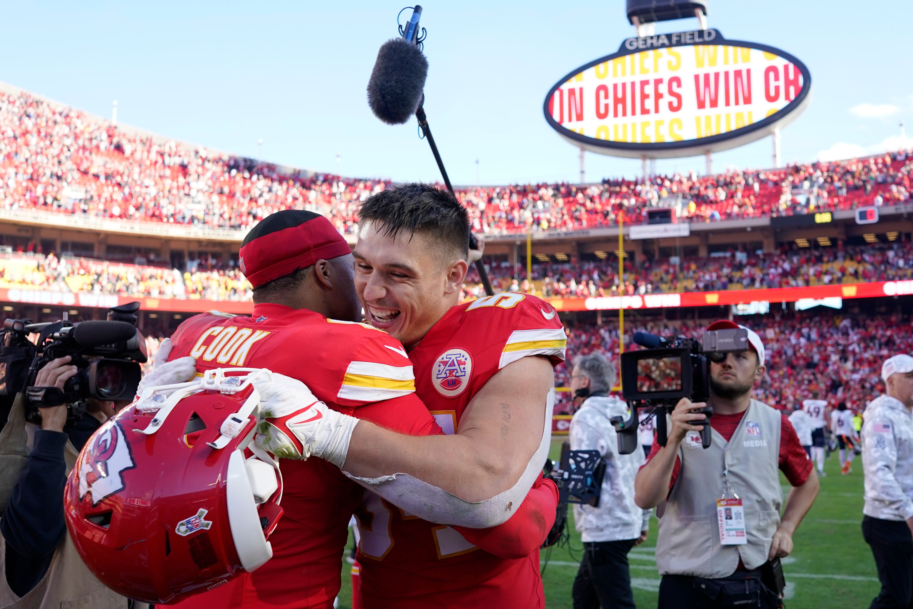 Kansas City Chiefs linebacker Leo Chenal, right, and teammate Bryan Cook celebrate a 16-14 victory over the Denver Broncos following an NFL football game Sunday, Nov. 10, 2024, in Kansas City, Mo. (AP Photo/Ed Zurga)