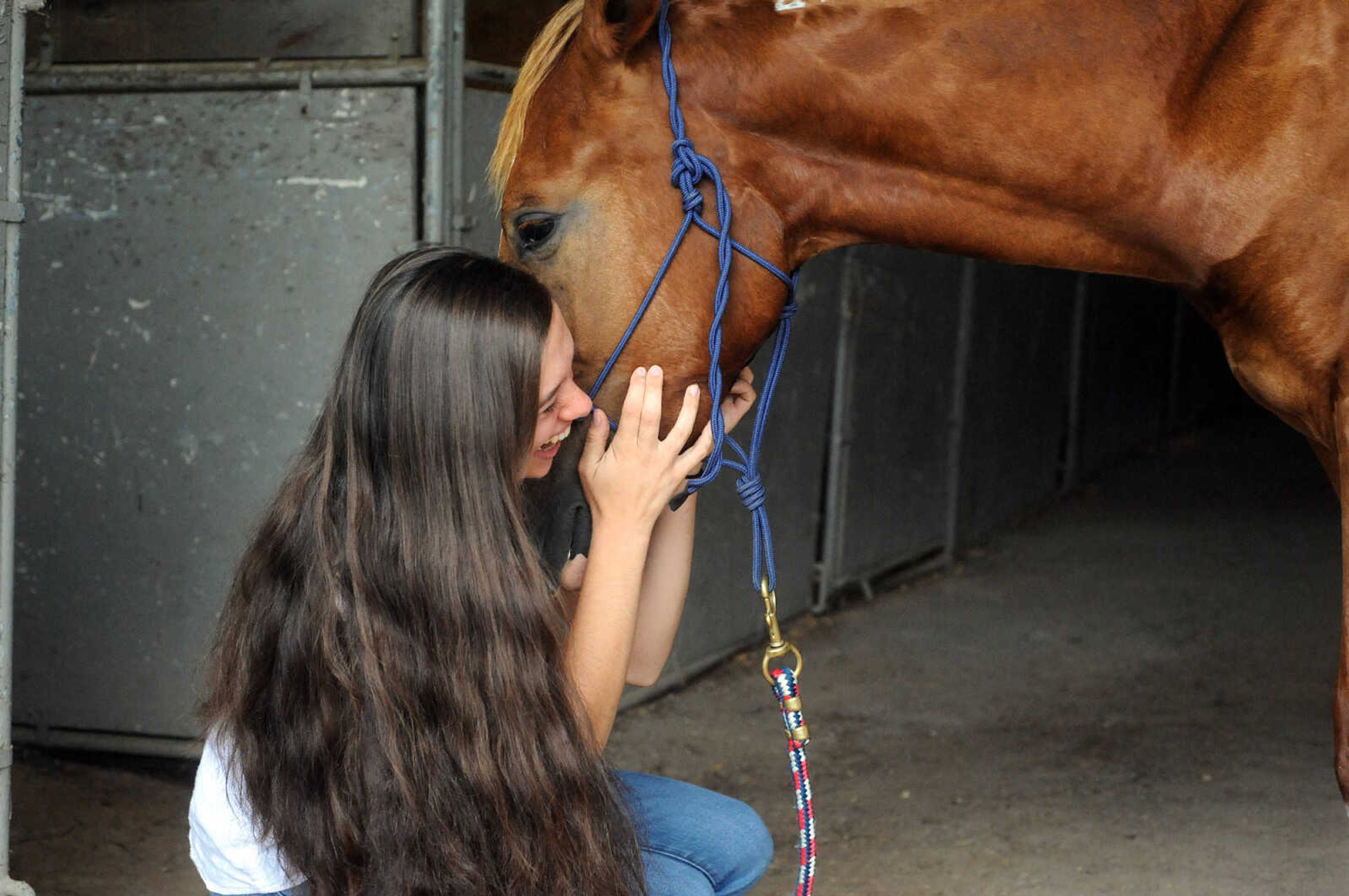 LAURA SIMON ~ lsimon@semissourian.com

Allison Elfrink and her wild mustang, Chico, at Flickerwood Arena in Jackson, Missouri, Wednesday, Aug. 5, 2015.