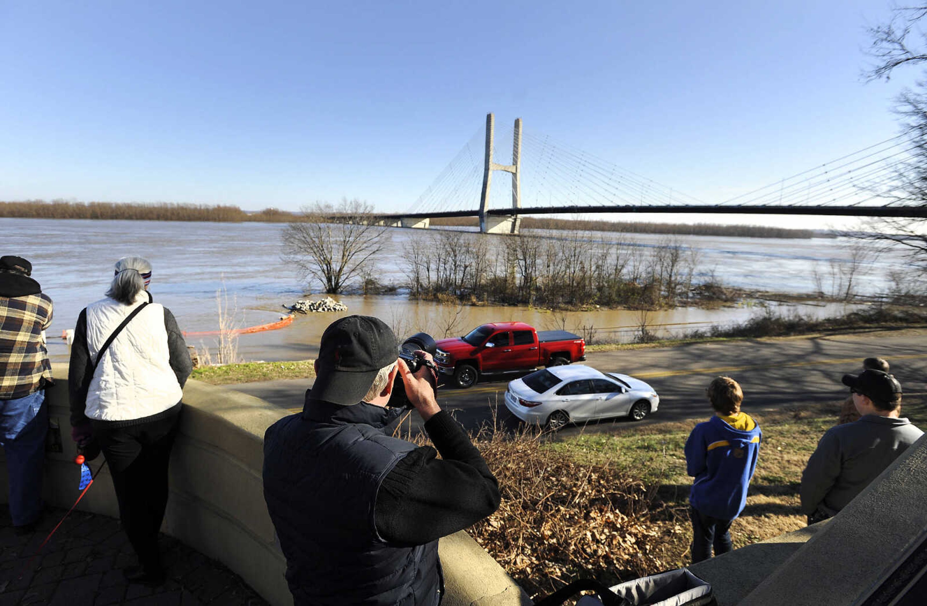 LAURA SIMON ~ lsimon@semissourian.com

People flood to the old Cape Girardeau bridge overlook to catch a glimpse of the swollen Mississippi River, Saturday, Jan. 2, 2016.