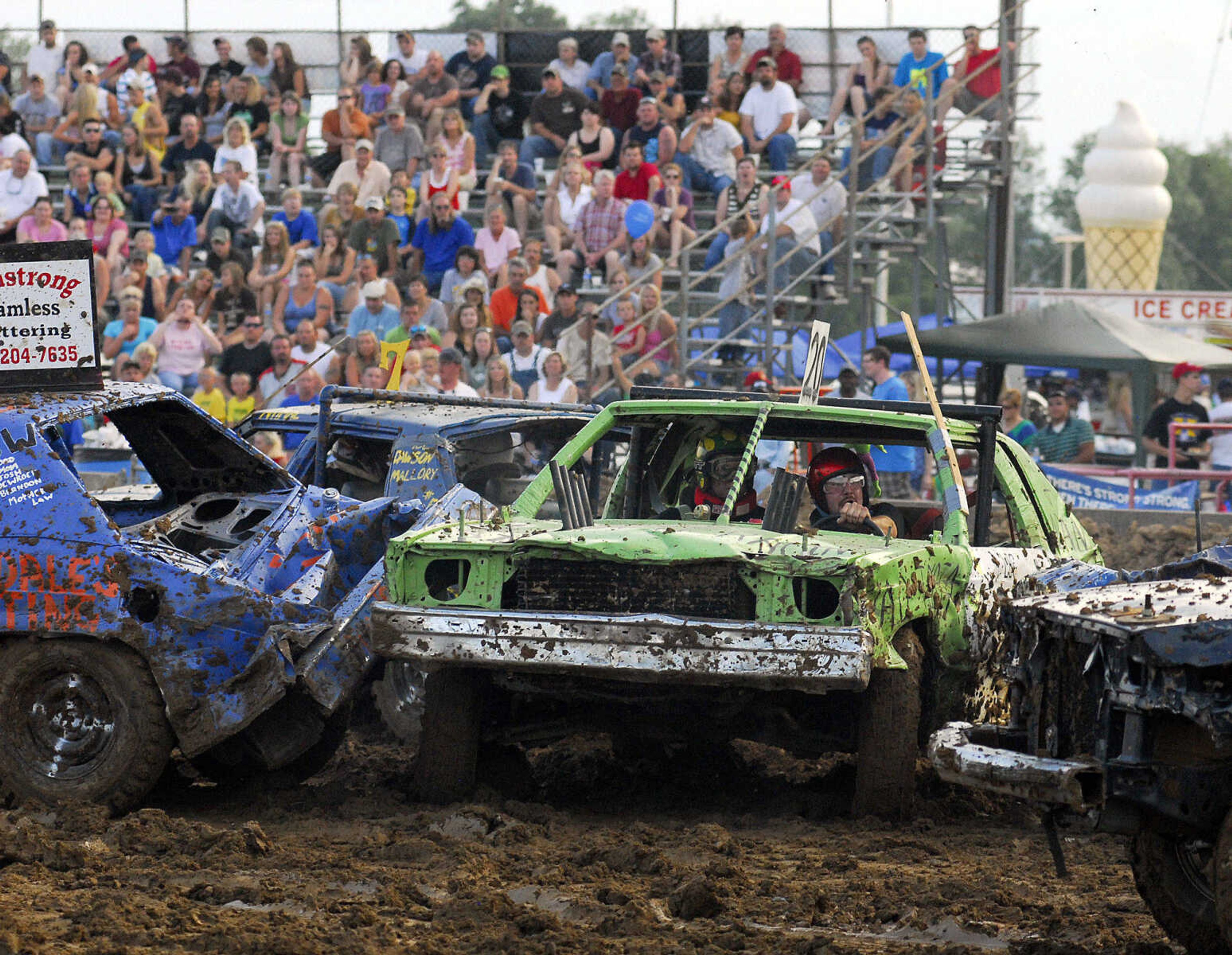 LAURA SIMON~lsimon@semissourian.com
The dual demolition derby drew in large numbers during the U.S.A. Veterans Fourth of July celebration at Arena Park in Cape Girardeau Sunday, July 4, 2010.