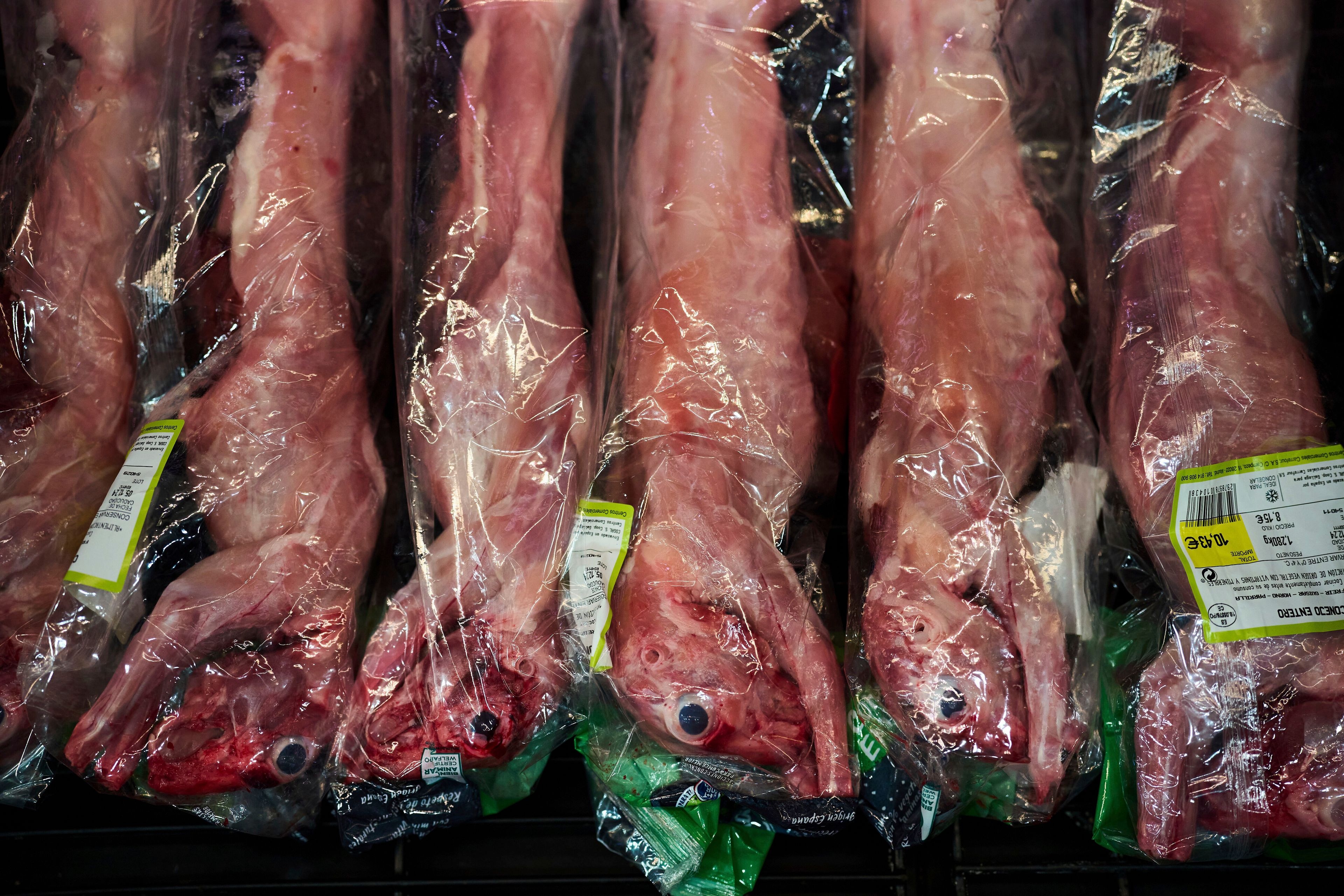 Rabbits wrapped in plastic bags are displayed for sale at a market in downtown Barcelona, Spain, Wednesday, Nov. 27, 2024. (AP Photo/Emilio Morenatti)