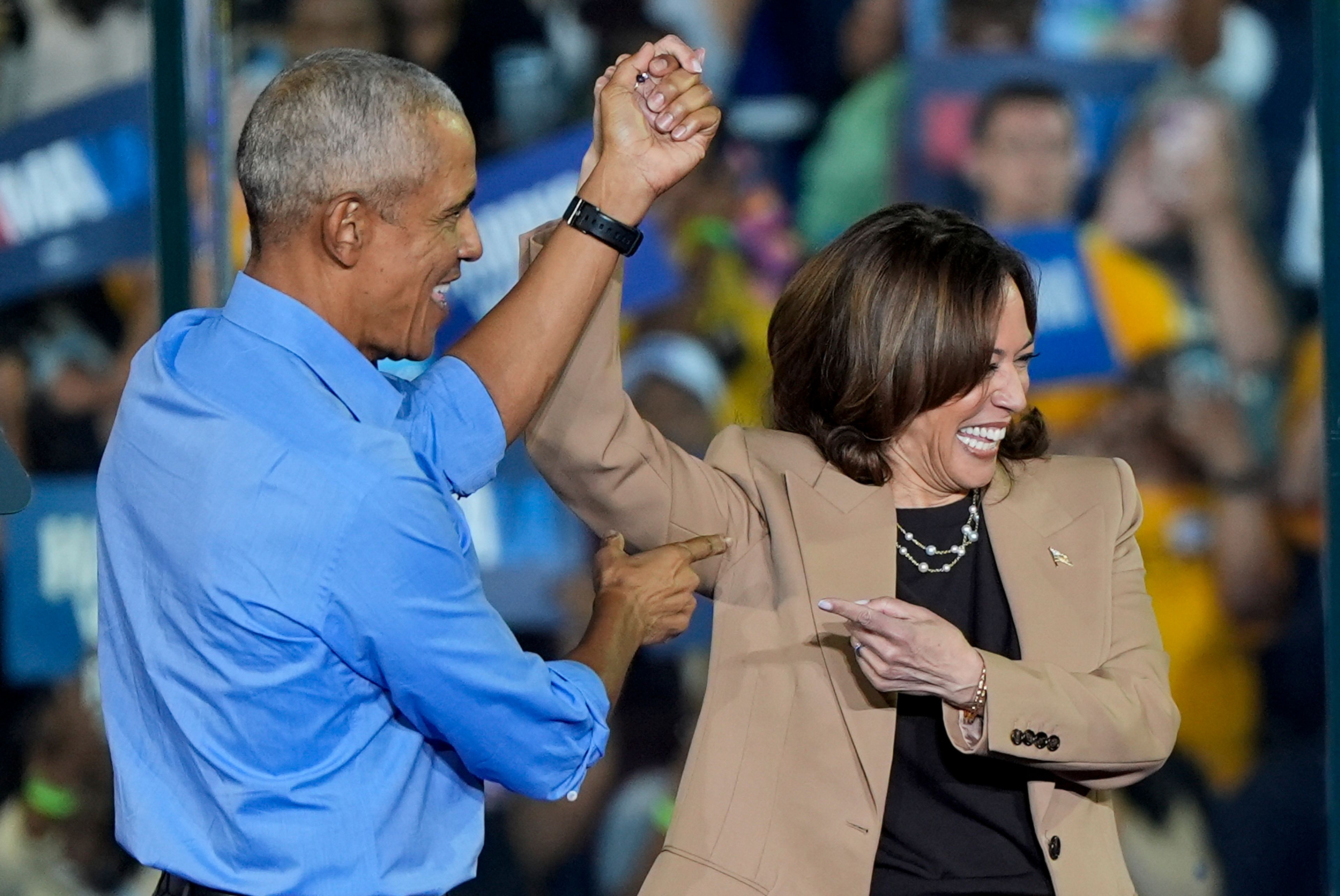 Former President Barack Obama gestures to Democratic presidential nominee Vice President Kamala Harris after introducing her to speak during a campaign rally for Harris on Thursday, Oct. 24, 2024, in Clarkston, Ga. (AP Photo/Mike Stewart)