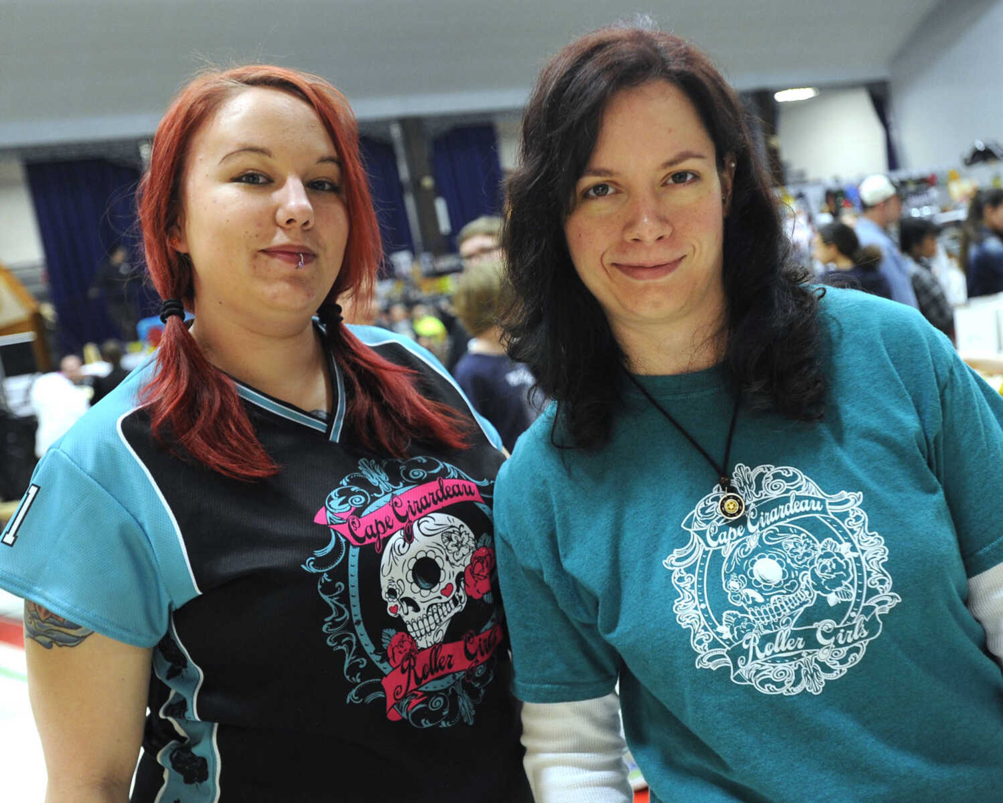 Desert Seidelman as "Killer Magnolia" and Rebekah Cowin as "Rogue Bludger" represent the Cape Girardeau Roller Girls at Cape Comic Con on Saturday, March 22, 2014 at the Arena Building.