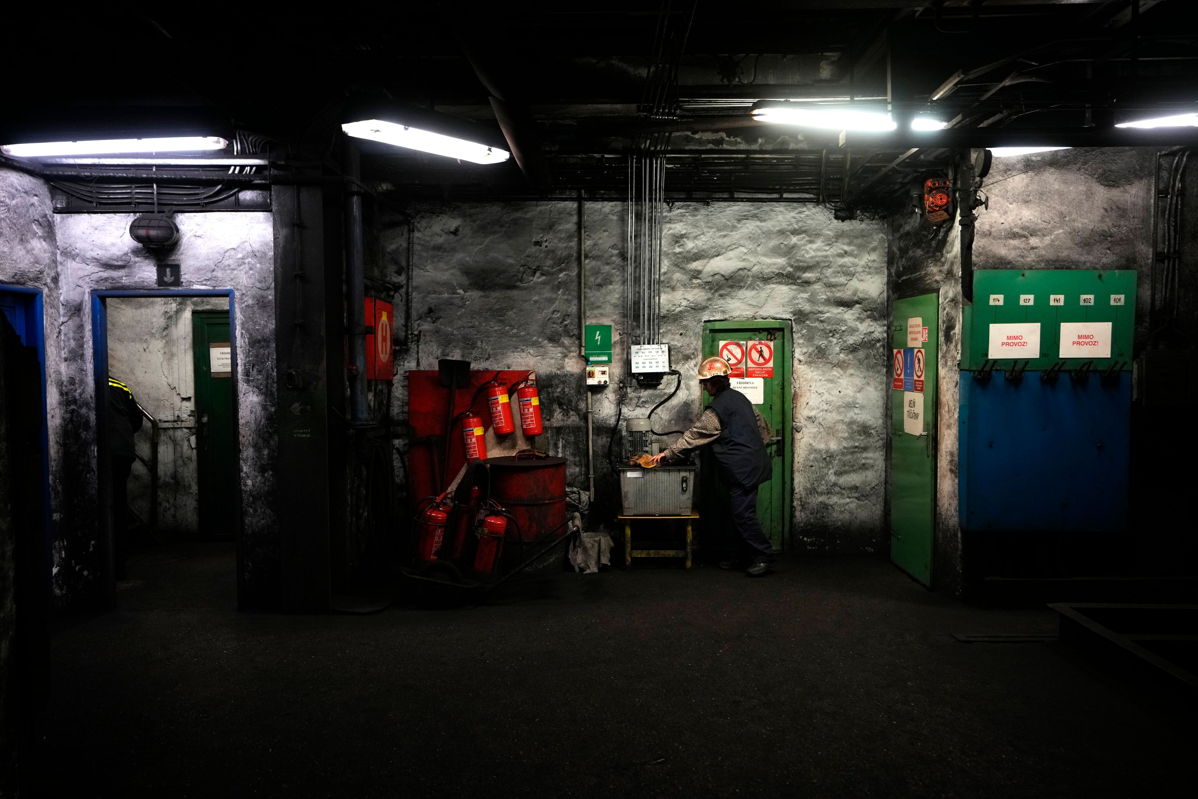 A worker gets her gloves at the CSM coal mine in Stonava, Czech Republic, Monday, Oct. 14, 2024. (AP Photo/Petr David Josek)