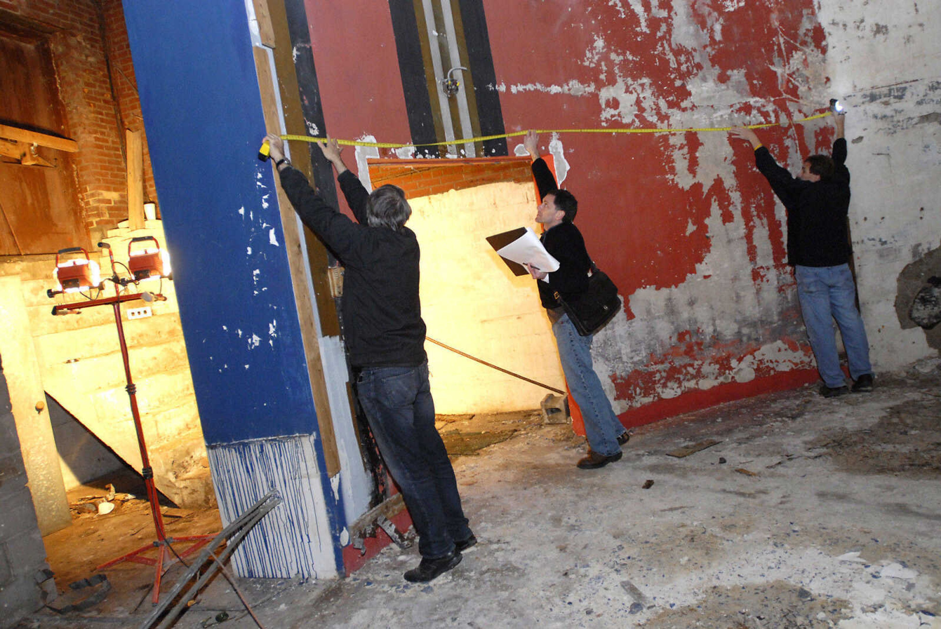 KRISTIN EBERTS ~ keberts@semissourian.com

From left, Kevin Flynn and David Leavy, of Kiku Obata & Company, and Glen Hinkebein, of Penzel Construction, work to take measurements of the Esquire Theater building on Friday, Jan. 6, 2012, in Cape Girardeau. Renovation work on the Esquire Theater continues as workers from Kiku Obata & Company and Penzel Construction complete field verification work and take measurements necessary for the design plans.