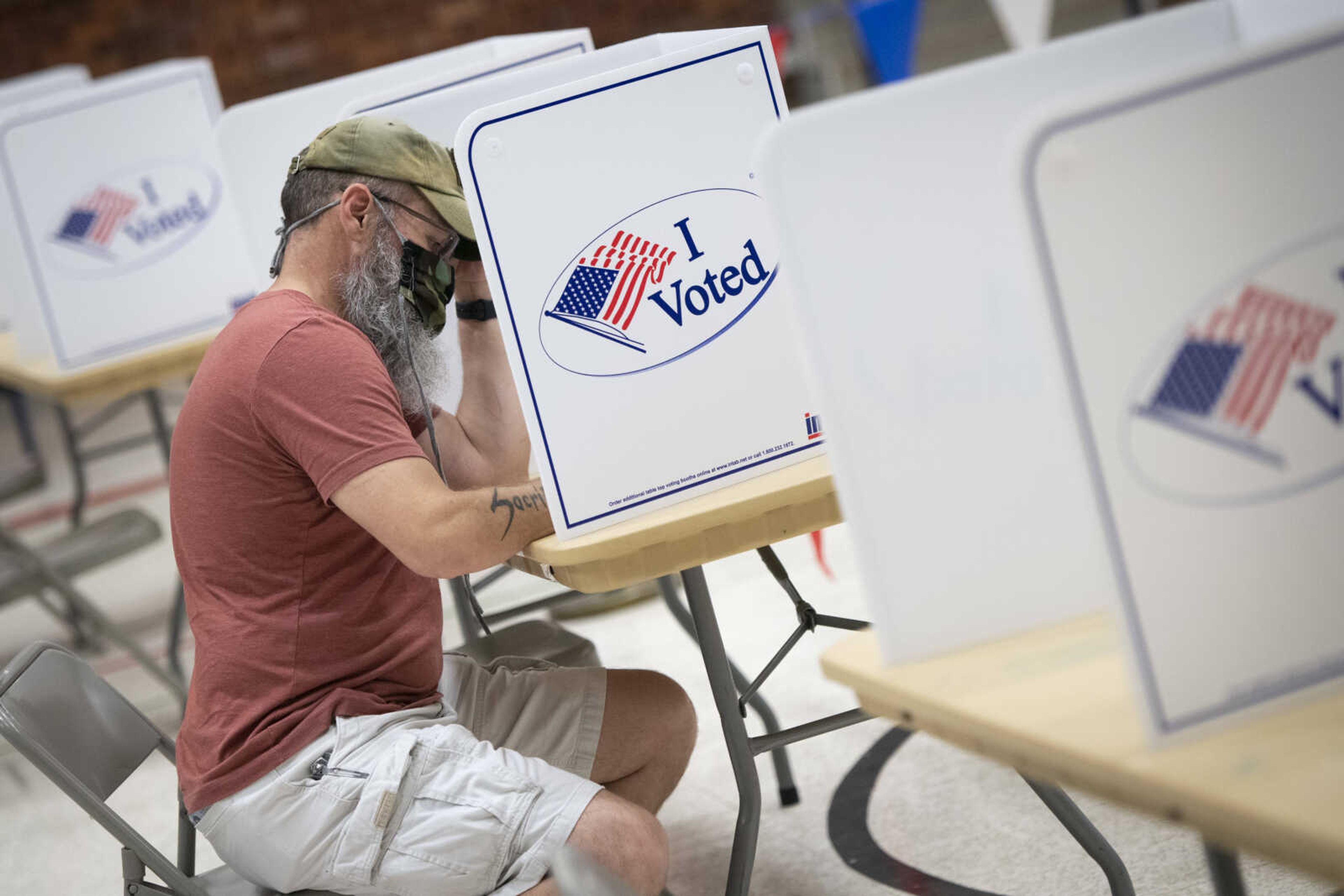 Jacob Wiegand ~ jwiegand@semissourian.com 
Chris Logsdon of Cape Girardeau votes while wearing a face mask Tuesday, June 2, 2020, at A.C. Brase Arena Building in Cape Girardeau. 