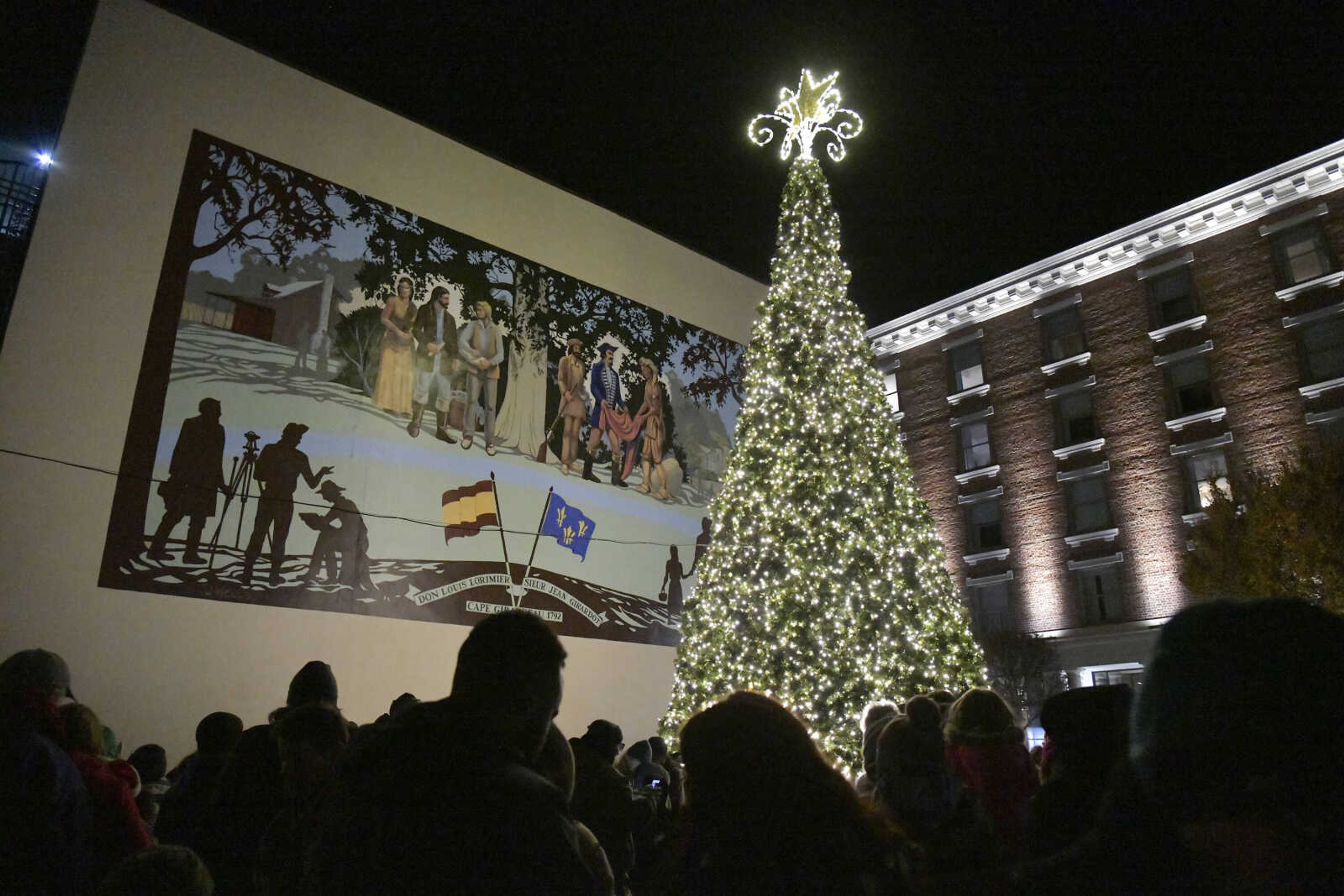 The crowd gathers around the tree during the 3rd Annual Old Town Cape Christmas Tree Lighting on Friday in Cape Girardeau.