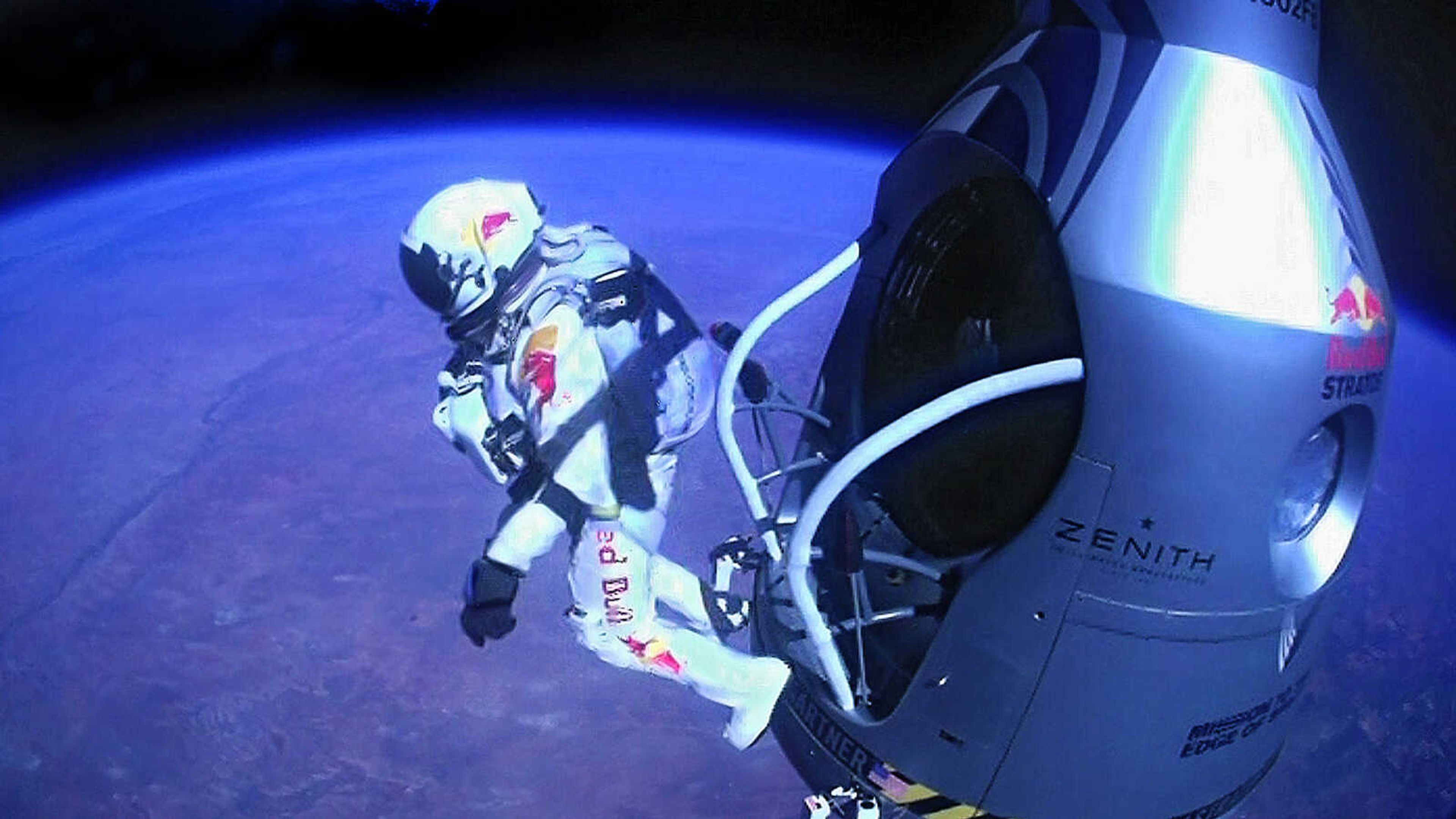 This image provided by Red Bull Stratos shows pilot Felix Baumgartner of Austria as he jumps out of the capsule during the final manned flight for Red Bull Stratos on Sunday, Oct. 14, 2012. In a giant leap from more than 24 miles up, Baumgartner shattered the sound barrier Sunday while making the highest jump ever -- a tumbling, death-defying plunge from a balloon to a safe landing in the New Mexico desert. (AP Photo/Red Bull Stratos)