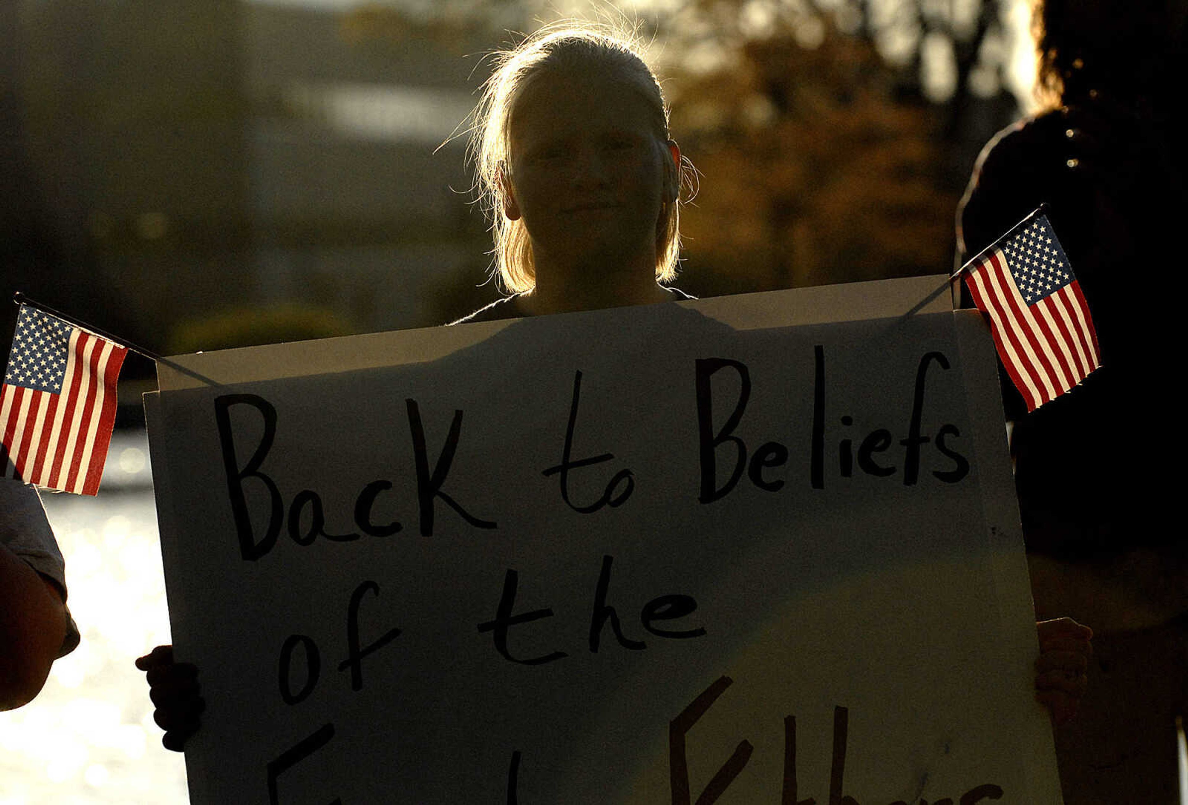 ELIZABETH DODD ~ edodd@semissourian.com
Katie Nance of Whitewater listens to speakers for two hours at Capaha Park in a rally protesting taxes.