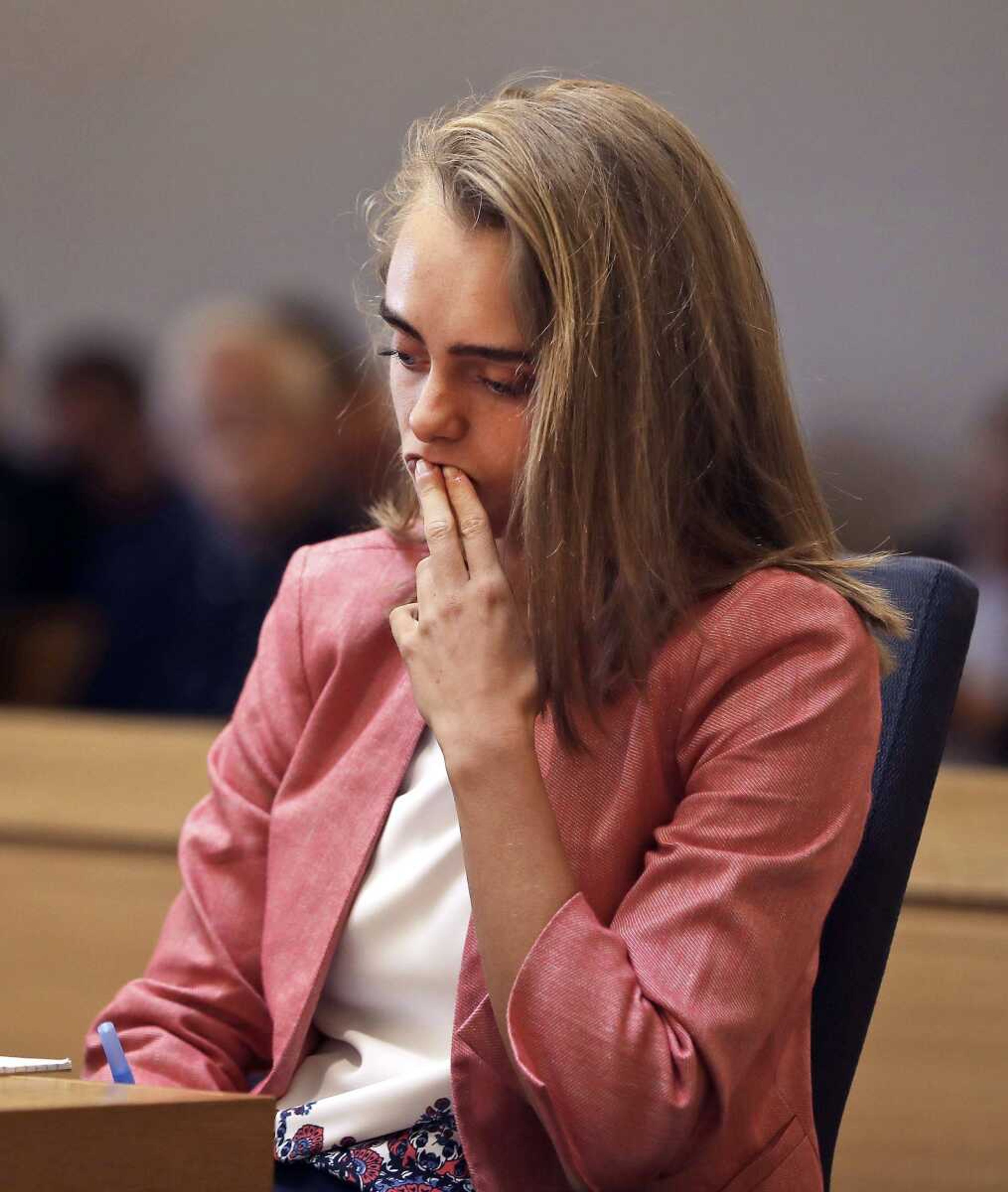 Defendant Michelle Carter listens as prosecutor Maryclare Flynn makes her opening statement Tuesday in Taunton, Massachusetts. Carter is charged with manslaughter for allegedly using text messages to encourage her 18-year-old boyfriend, Conrad Roy III, to kill himself.